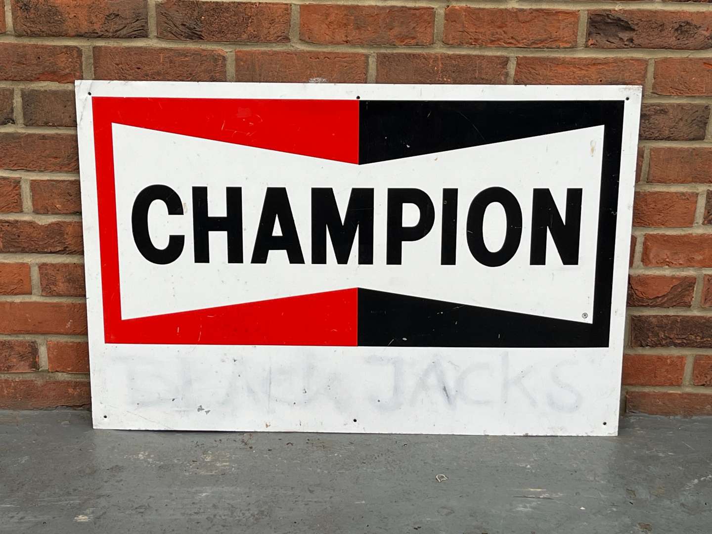 <p>Champion Spark Plugs Metal Sign</p>