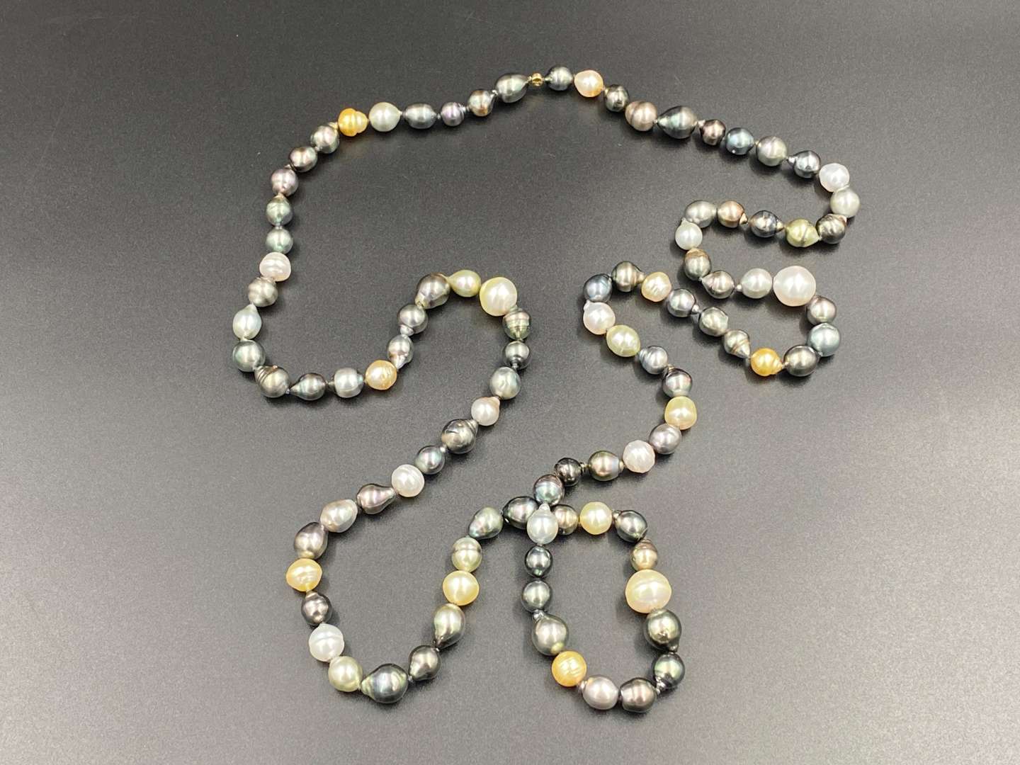 <p>SCHOEFFEL, a signed, single strand of colored freshwater pearls.</p>