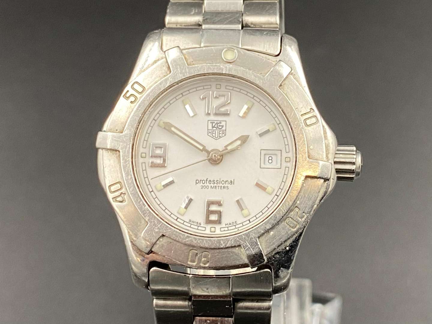 <p>TAG HEUER, “Professional”, stainless steel ladies centre seconds, calendar wristwatch. WN1311, AM0960</p>