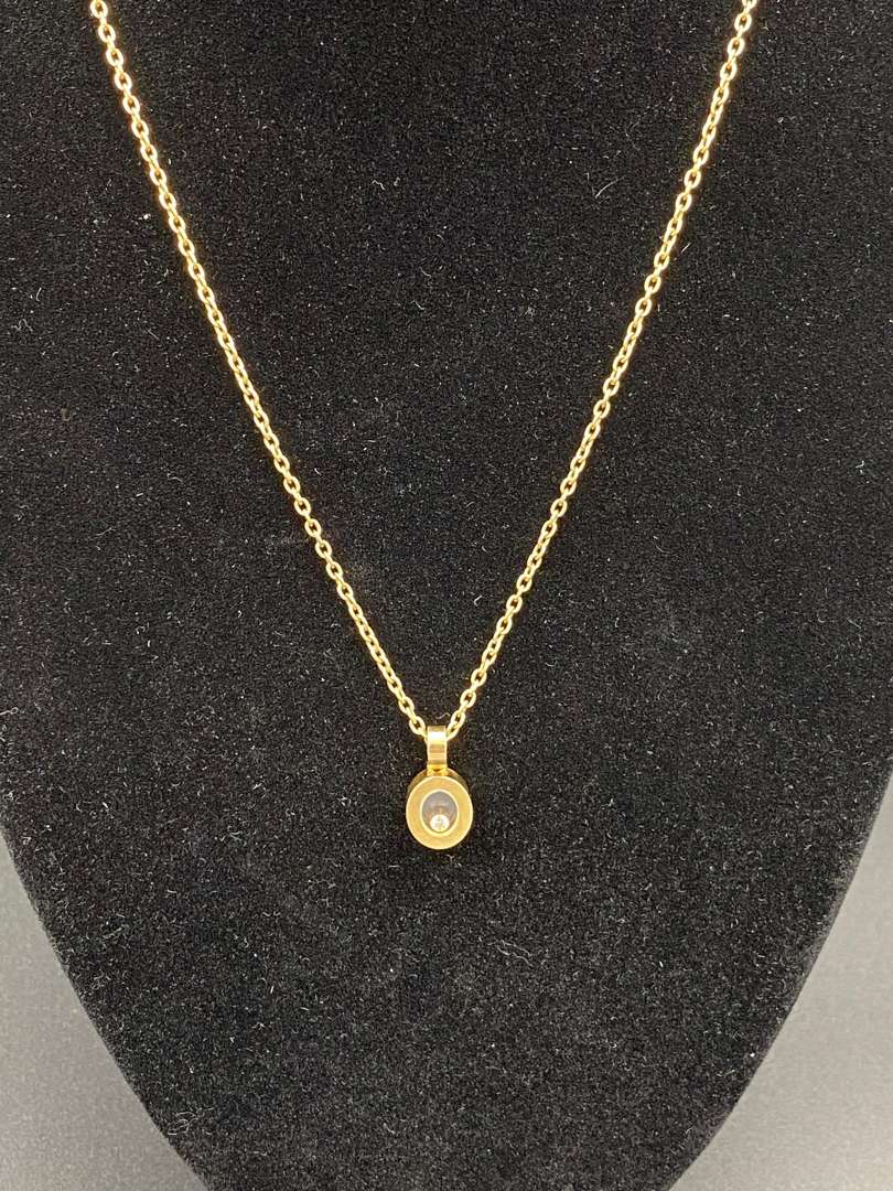 <p>CHOPARD, “Happy Diamond”, 18ct gold, glazed pendant & trace chain</p>