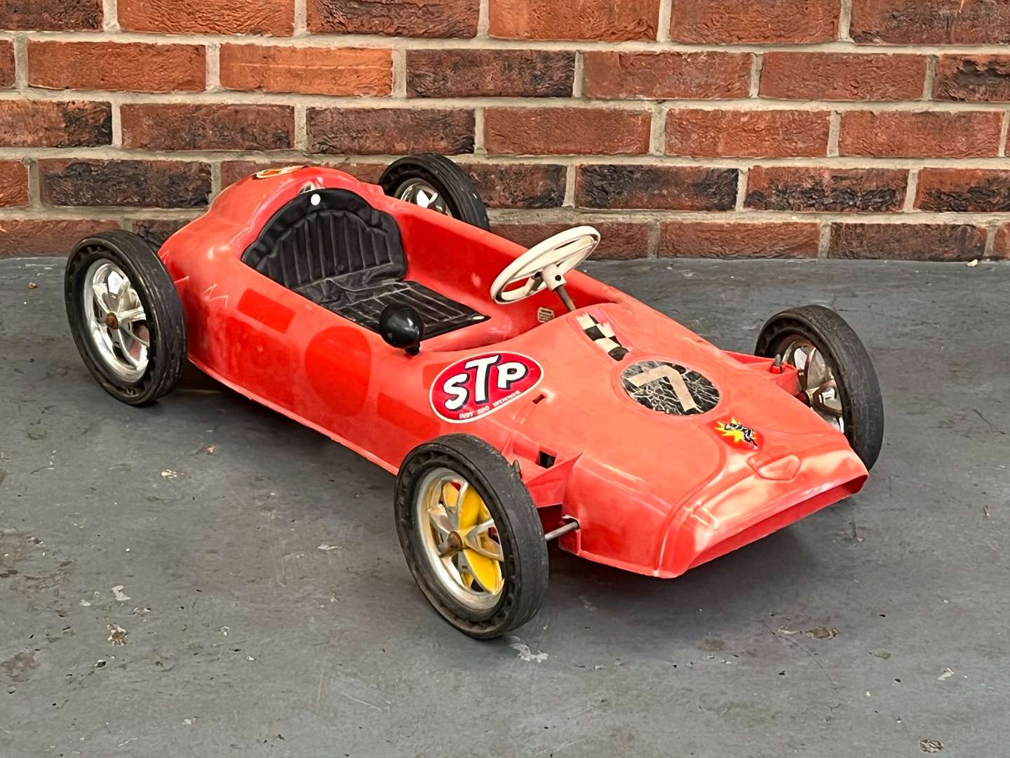 <p>Tri-Ang Plastic F1 Pedal Car</p>