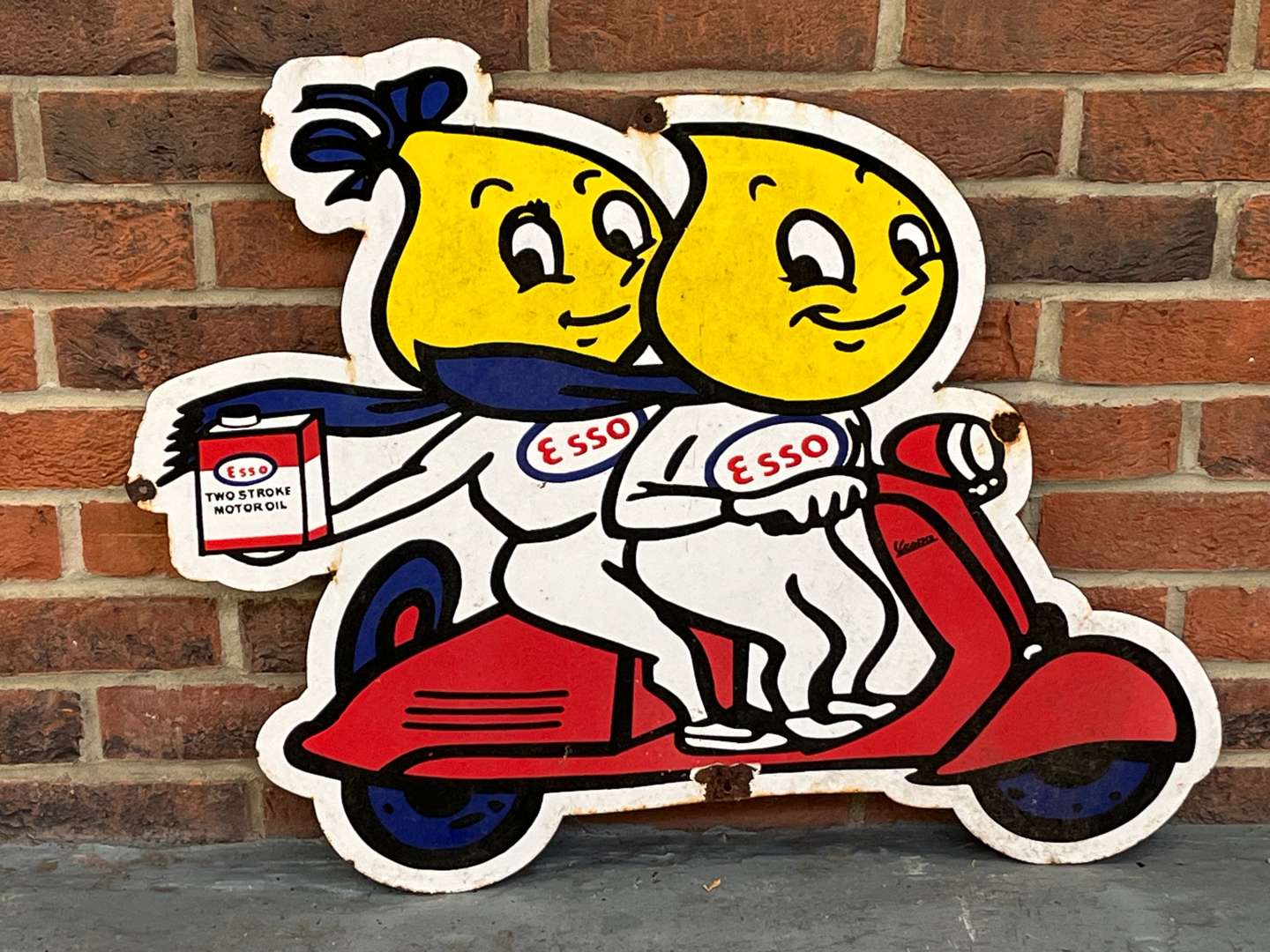 <p>Esso Mr and Mrs Drip On A Scooter Small Enamel Sign</p>