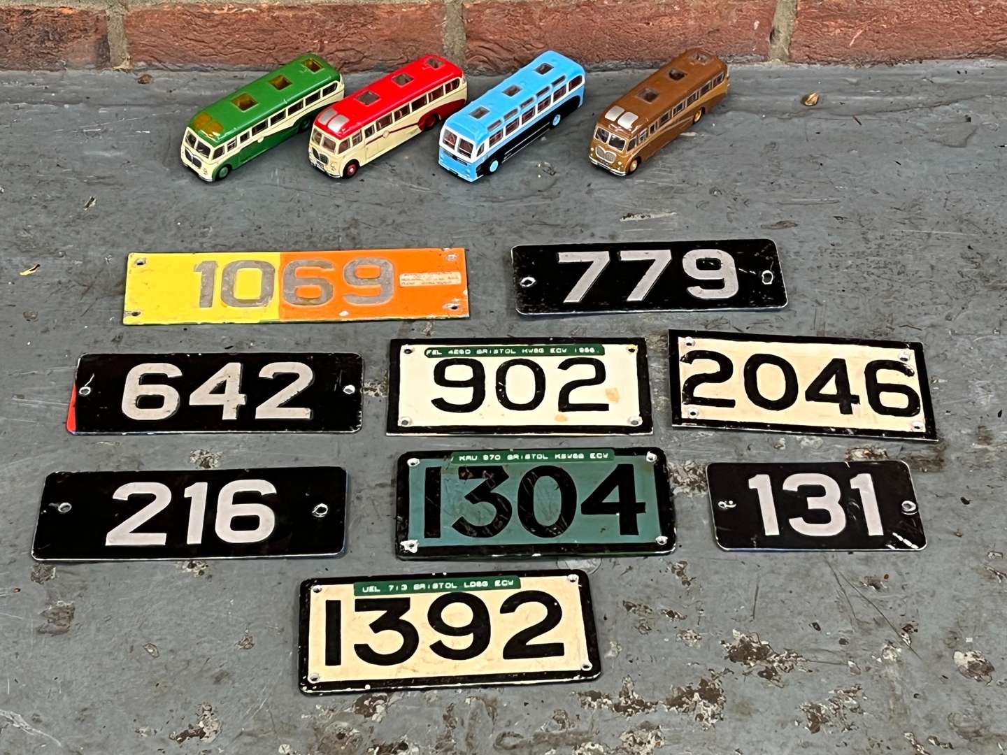 <p>Four Model Buses and Nine Metal Bus Numbers</p>