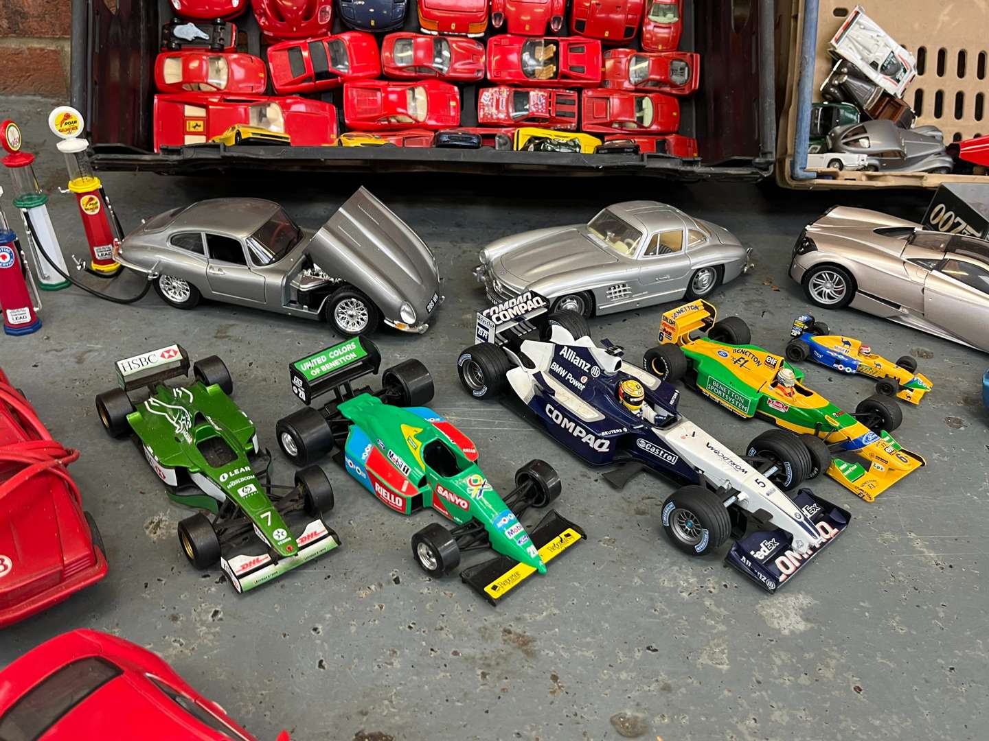 <p>Two Creates Of Ferrari, F1 Model Cars</p>