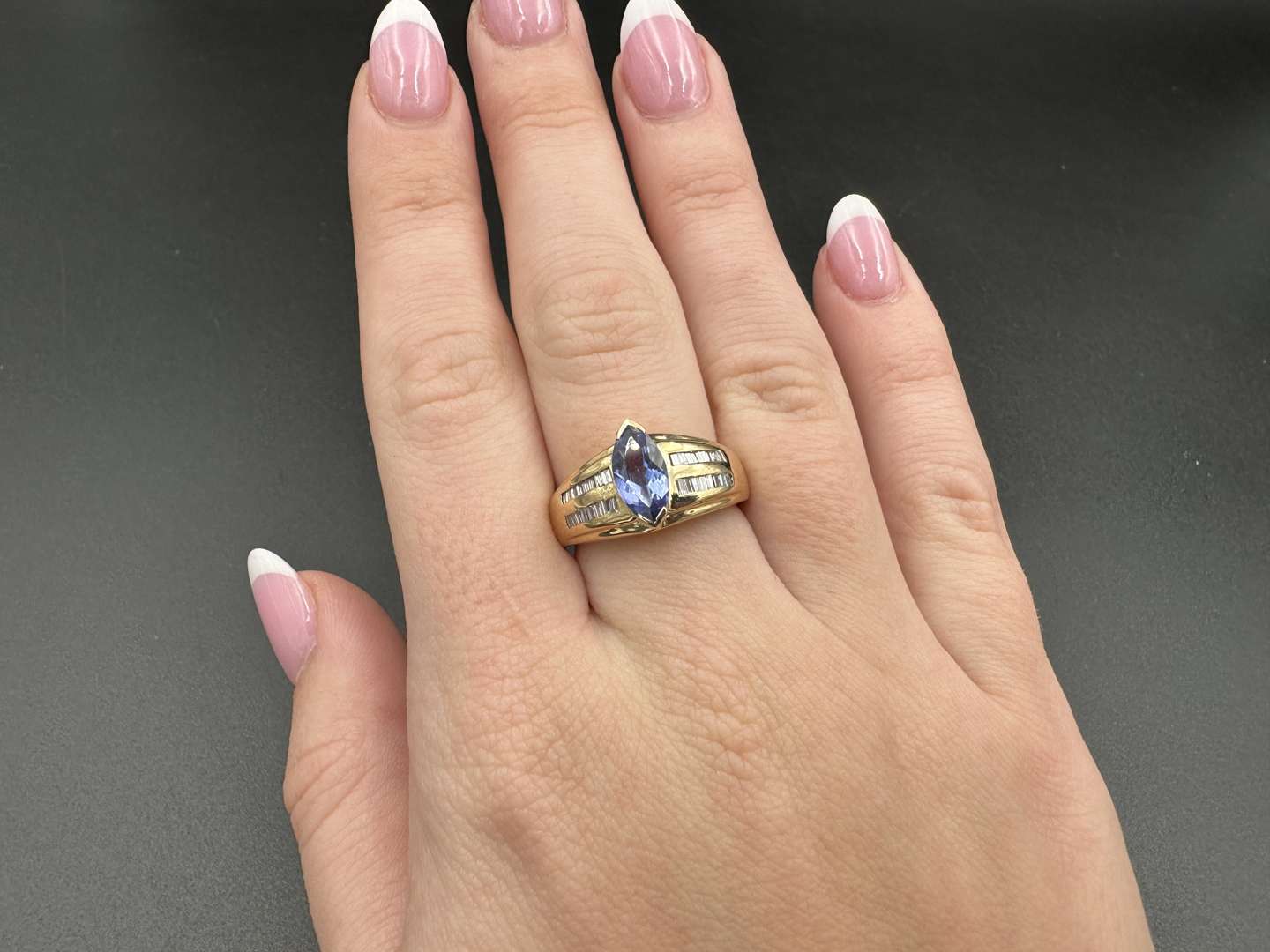 <p>Tanzanite and Diamond 14ct Gold Ring</p>