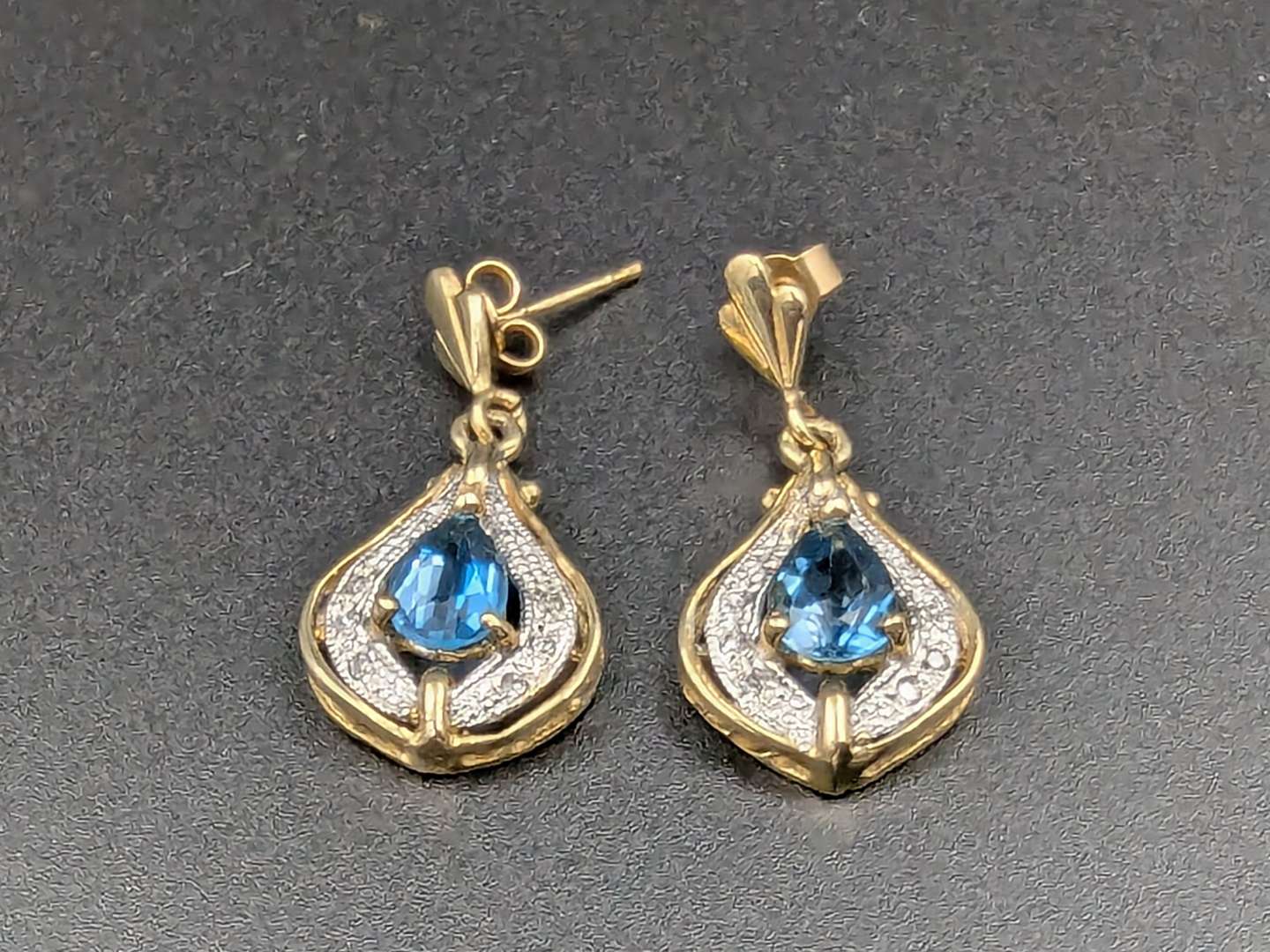 <p>blue Topaz & Diamond 9ct gold earrings</p>