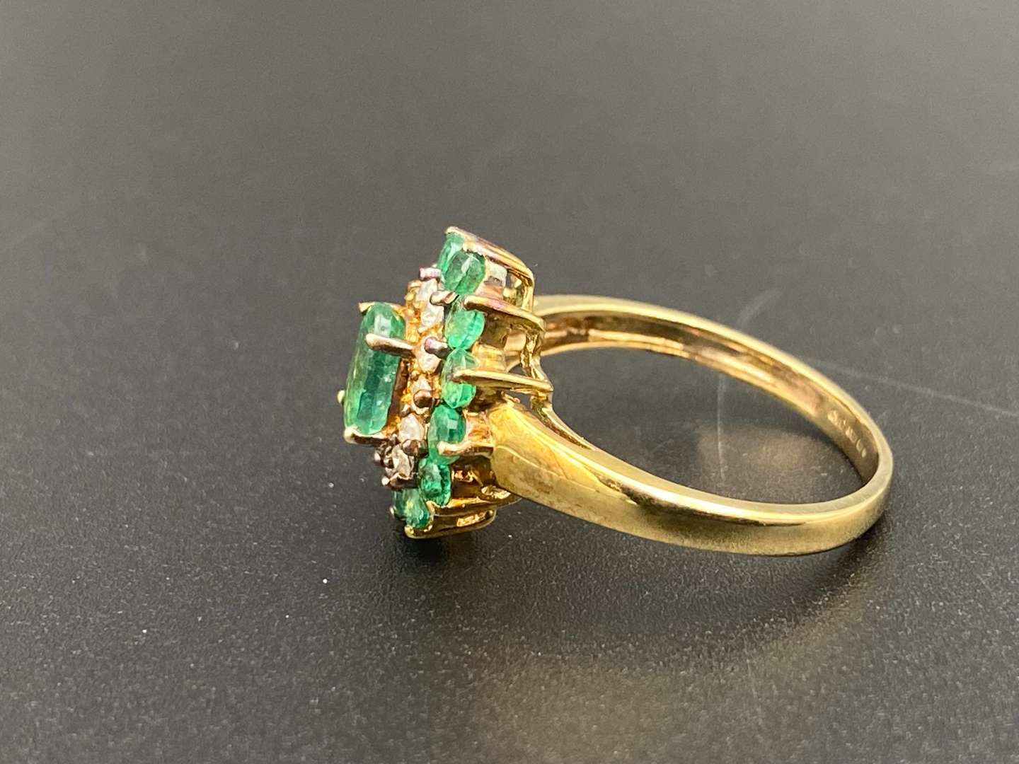 <p>An Emerald & Diamond 9ct gold cluster ring</p>