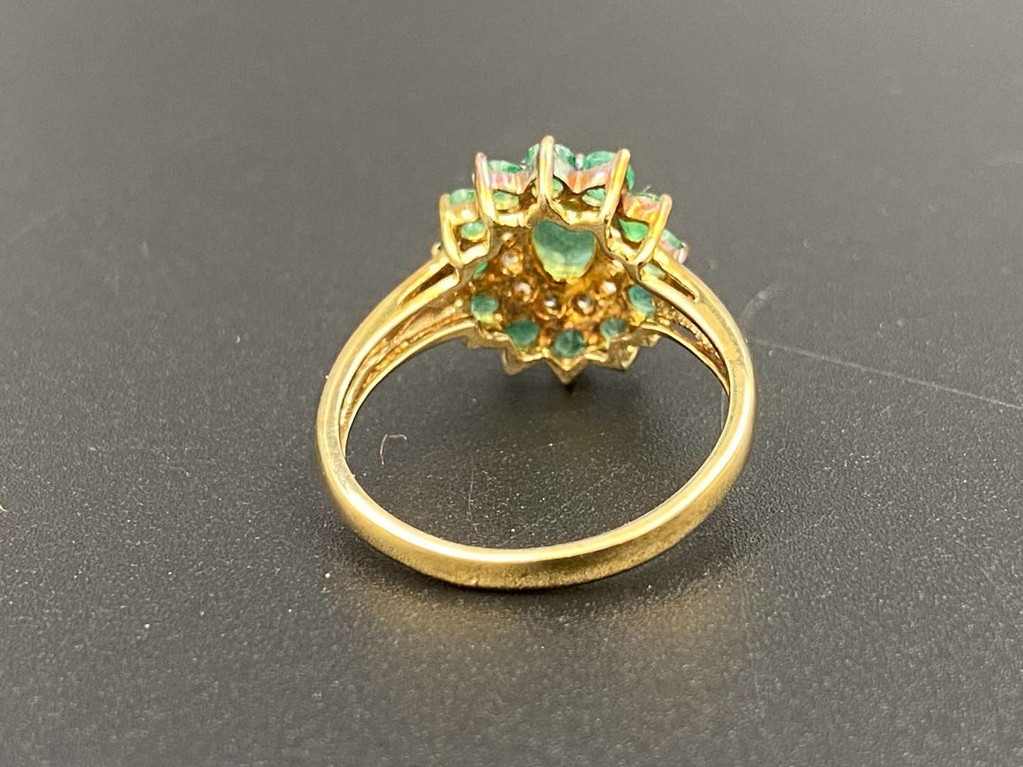 <p>An Emerald & Diamond 9ct gold cluster ring</p>