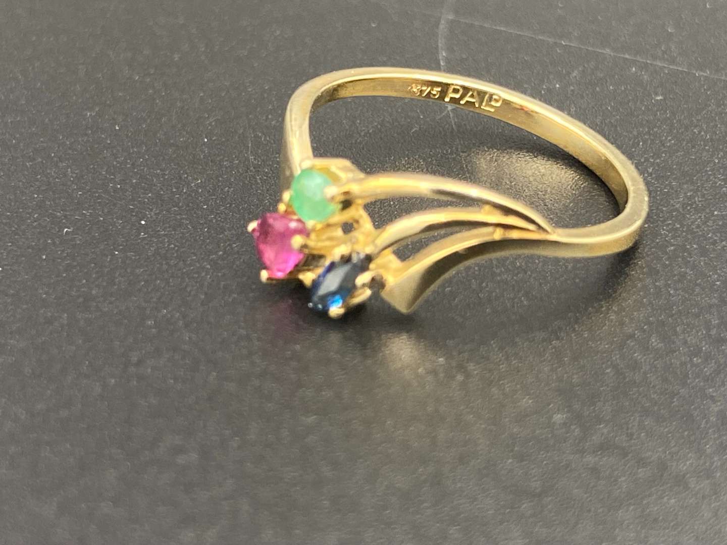 <p>An Emerald Ruby & Sapphire 9ct gold ring</p>