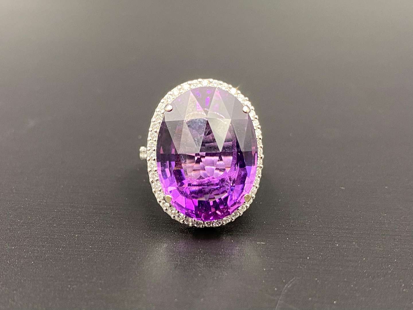 <p>Amethyst & Diamond oval 18ct white gold ring</p>