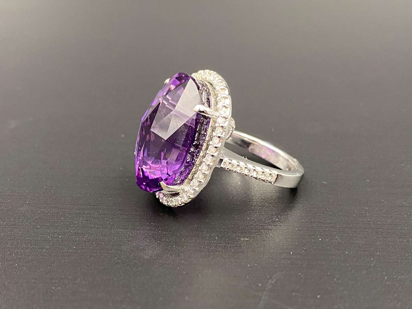 <p>Amethyst & Diamond oval 18ct white gold ring</p>