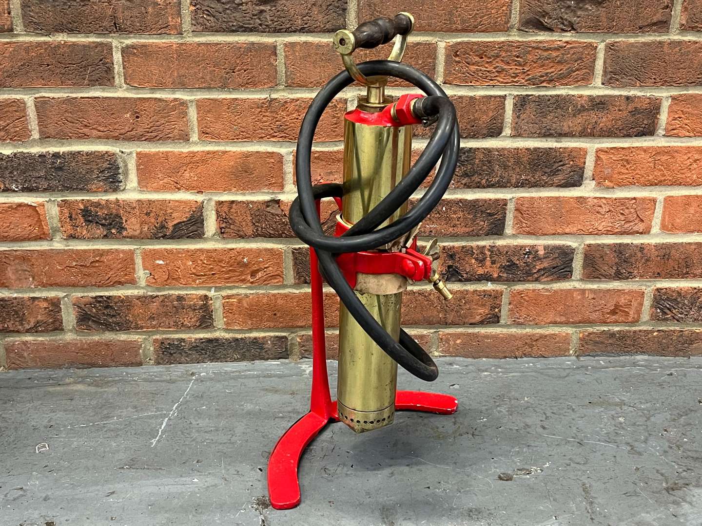 <p>Metal Fire Bucket and Brass Pump on Stand</p>