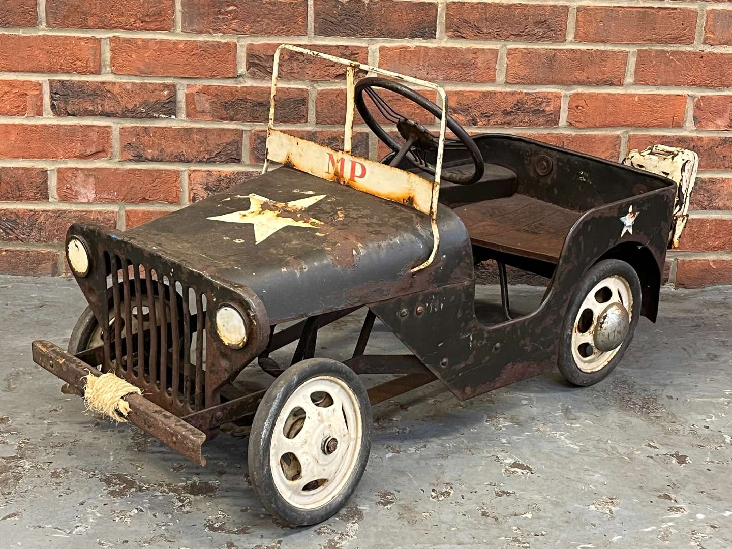 <p>Tin Plate Willys Jeep Childs Pedal Car</p>