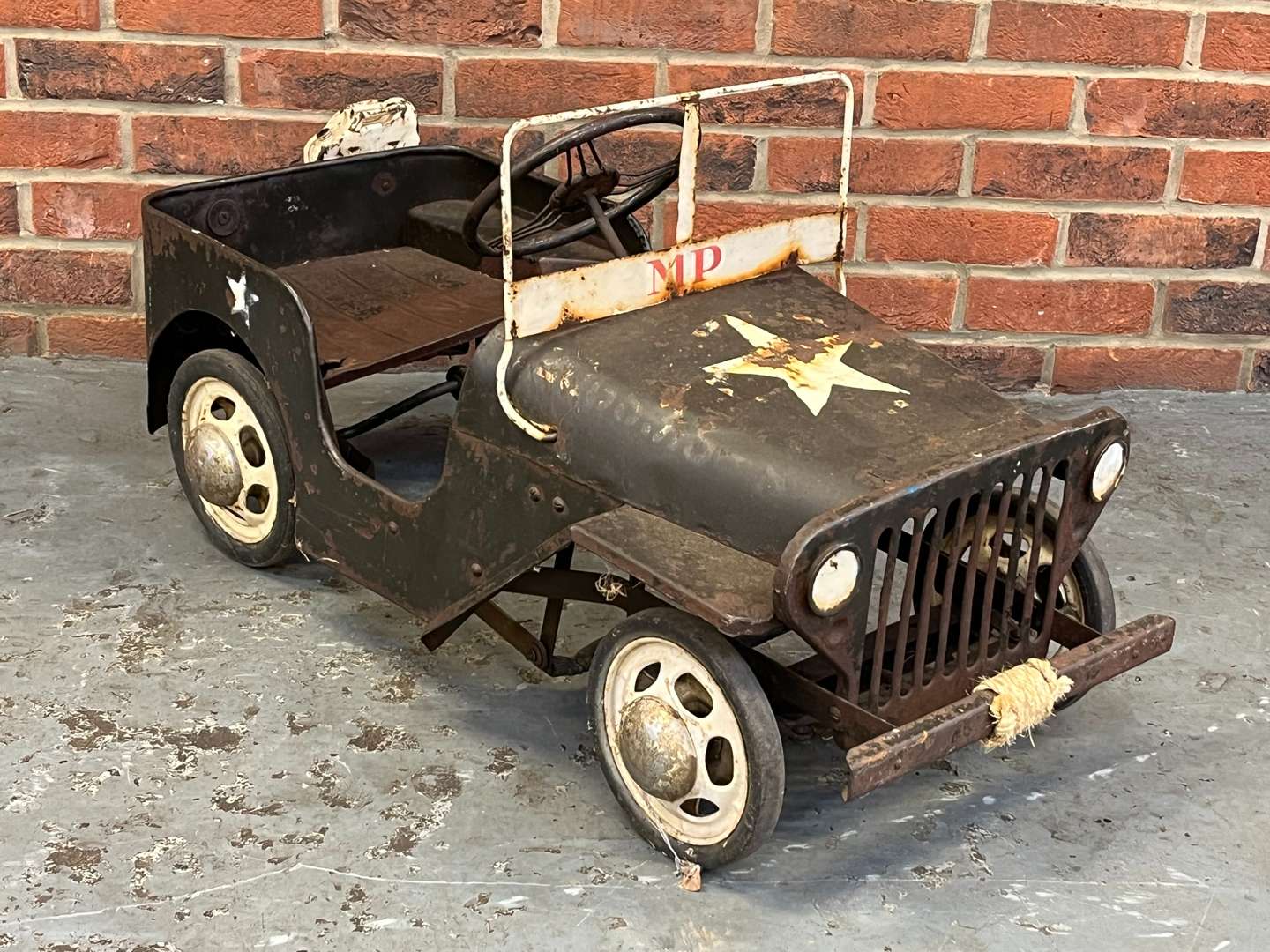 <p>Tin Plate Willys Jeep Childs Pedal Car</p>