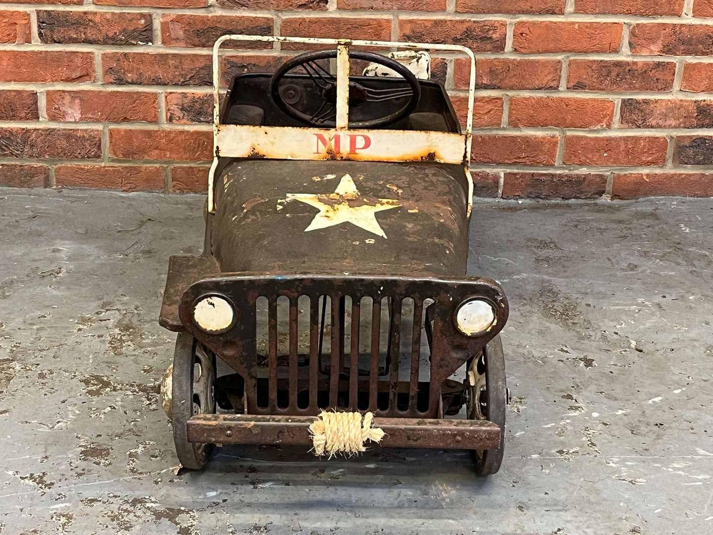 <p>Tin Plate Willys Jeep Childs Pedal Car</p>