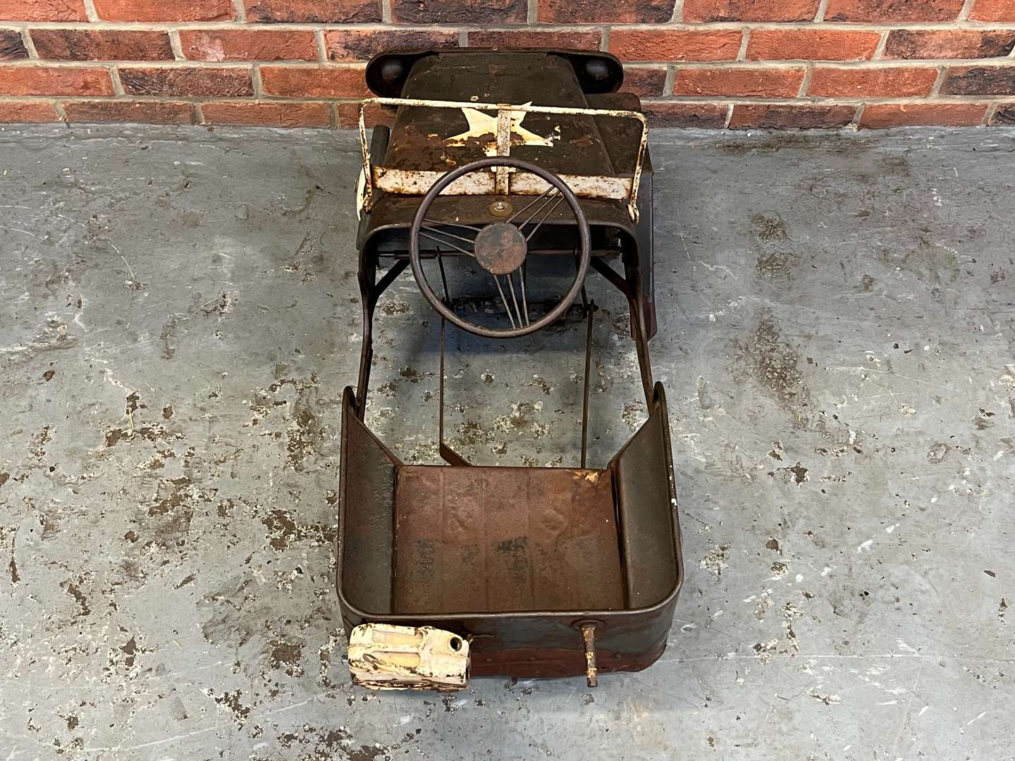 <p>Tin Plate Willys Jeep Childs Pedal Car</p>