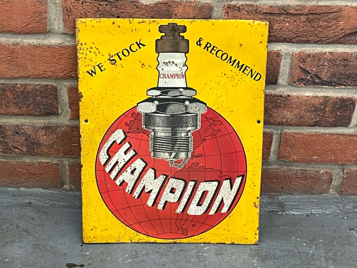 <p>Champion Tin Spark Plug Sign</p>