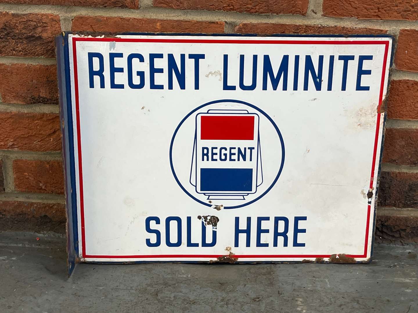 <p>Regent Luminite Sold Here Enamel Flange Sign</p>