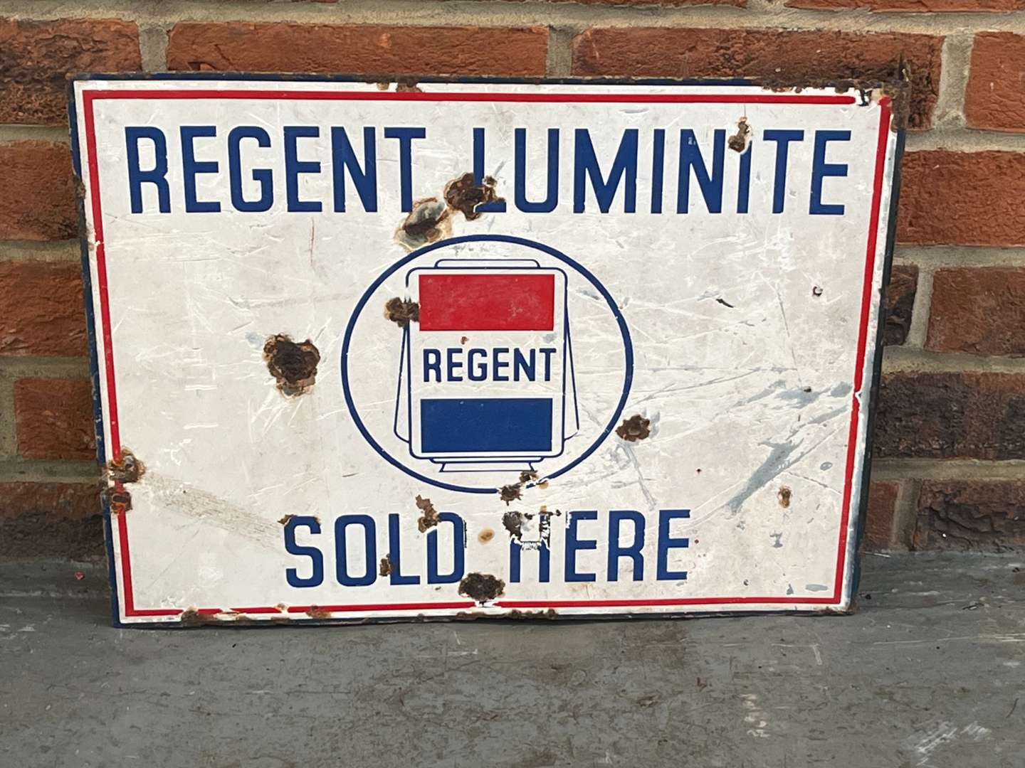 <p>Regent Luminite Sold Here Enamel Flange Sign</p>