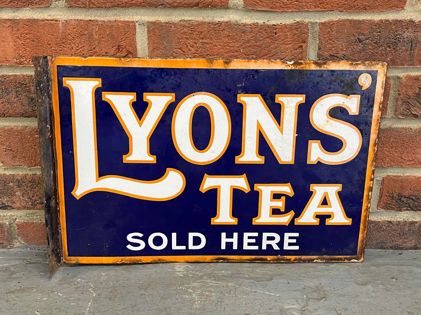 <p>Lyons Tea Sold Here Enamel Flange Sign</p>