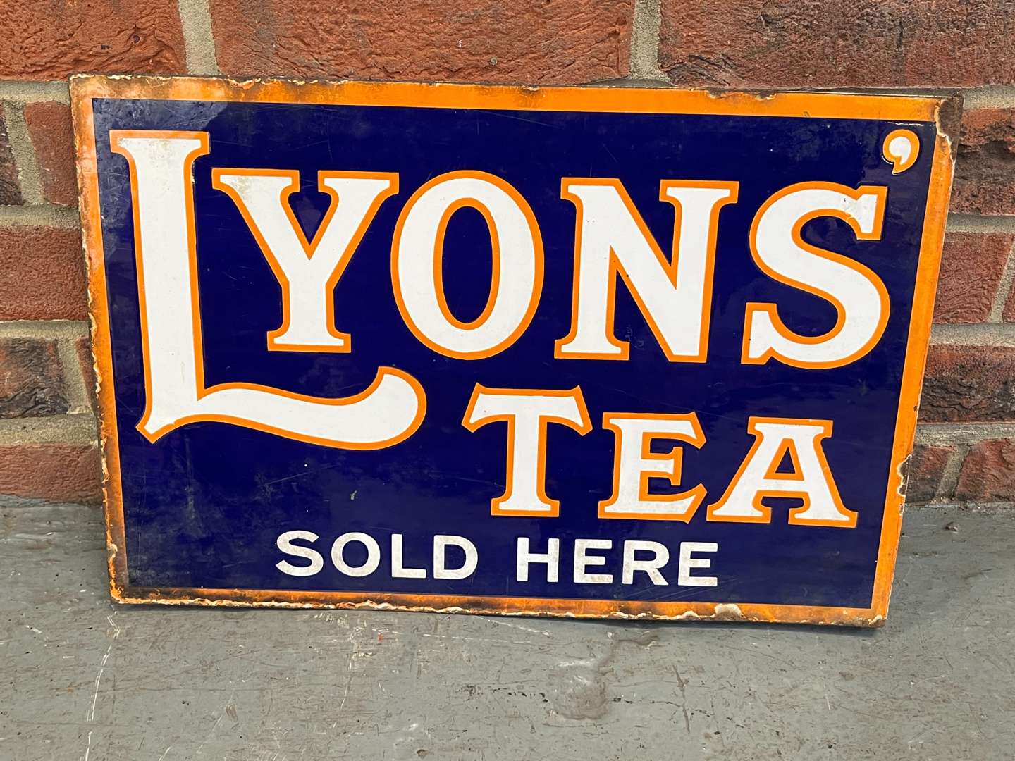 <p>Lyons Tea Sold Here Enamel Flange Sign</p>