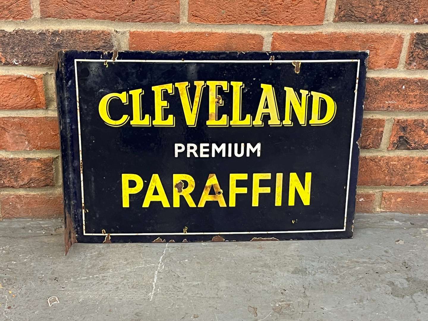 <p>Cleveland Paraffin Enamel Flange Sign</p>