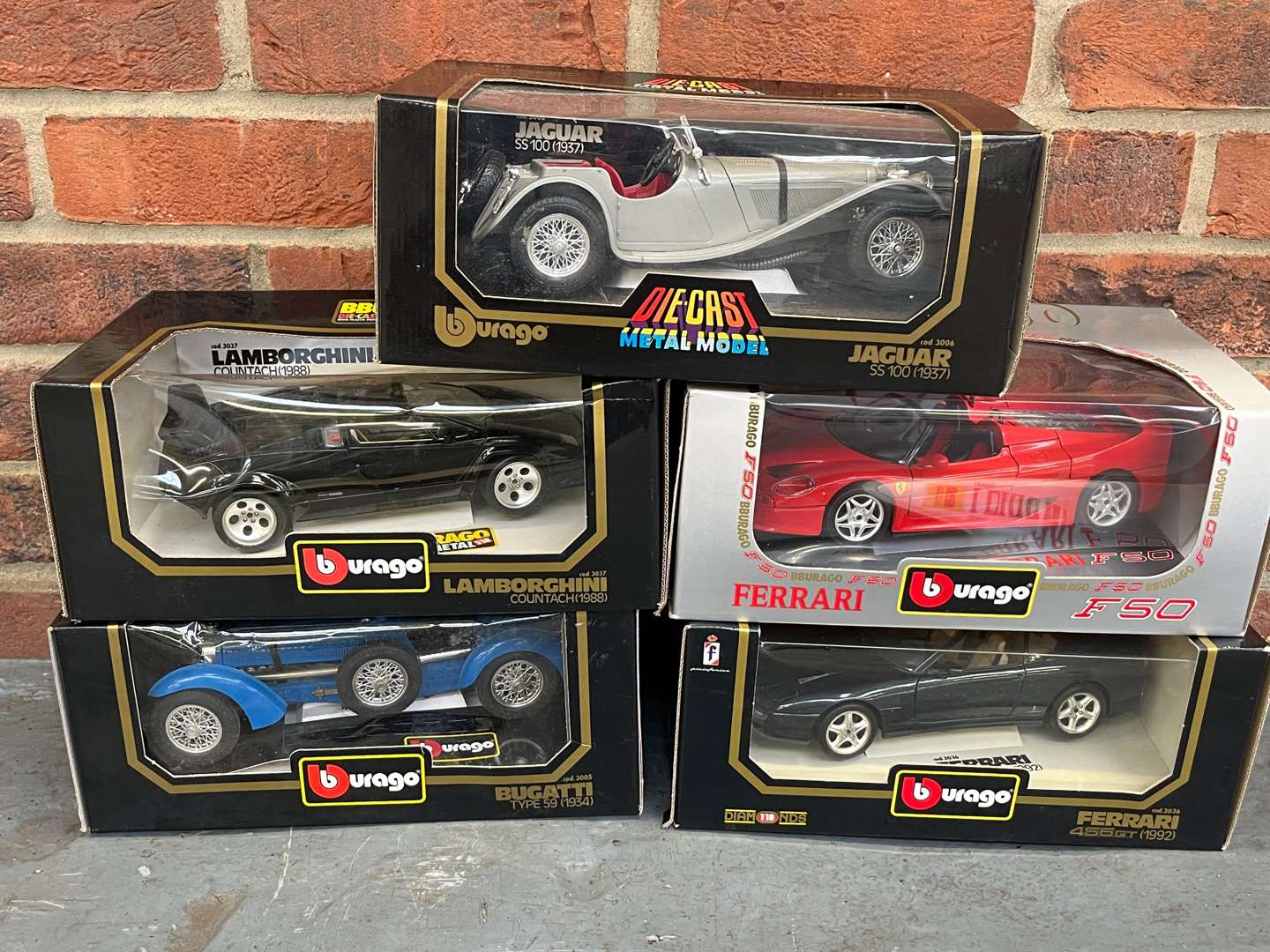 <p>Five Boxed Burago Model Cars</p>