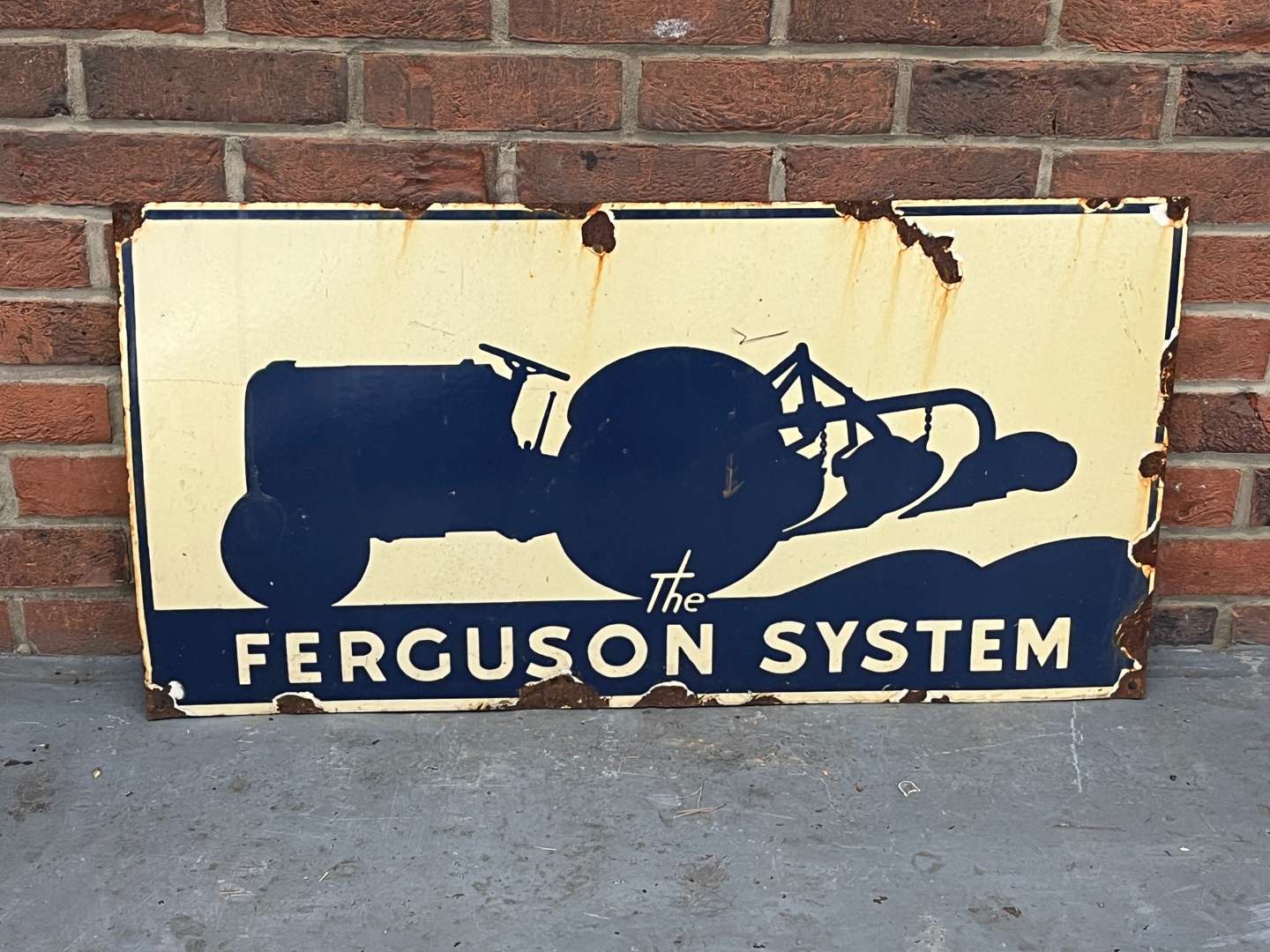 <p>The Ferguson System Enamel Sign</p>