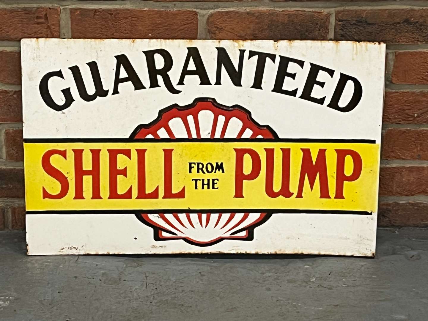 <p>Shell From The Pump Guaranteed Enamel Flange Sign</p>