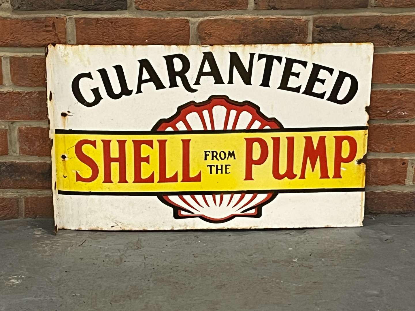 <p>Shell From The Pump Guaranteed Enamel Flange Sign</p>