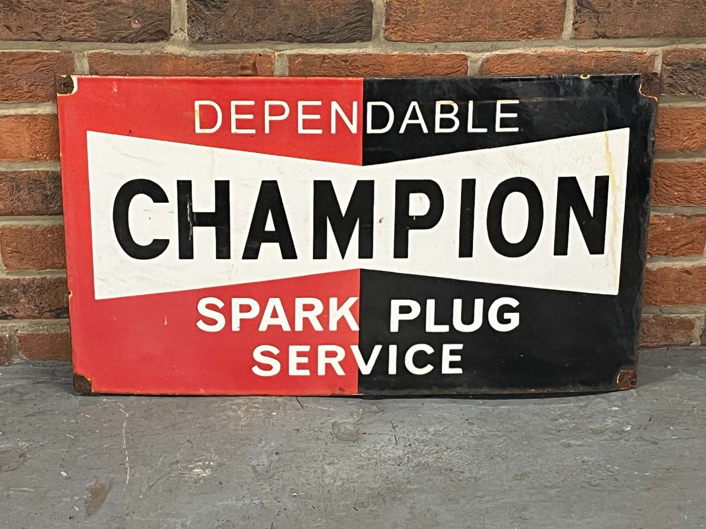 <p>Champion Spark Plugs Enamel Sign</p>