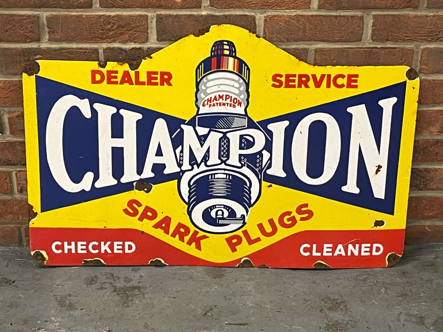 <p>Champion Spark Plugs Dealer Enamel Sign</p>