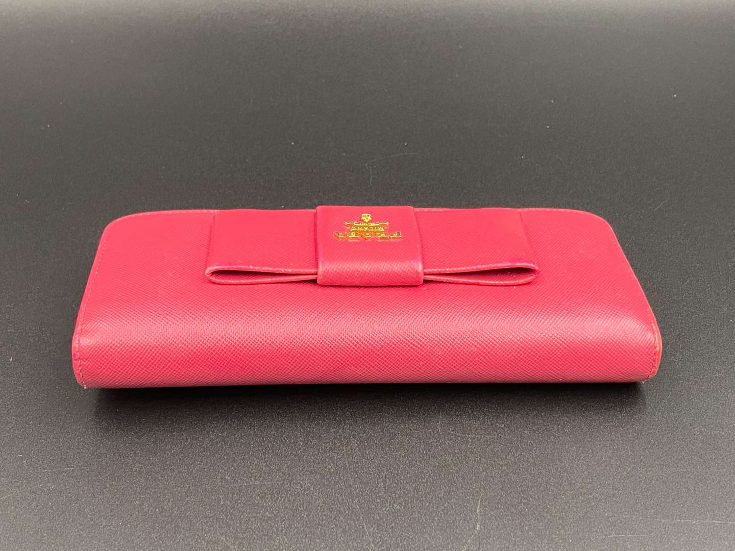 <p>PRADA, a Saffiano, pink leather, ribbon purse,</p>