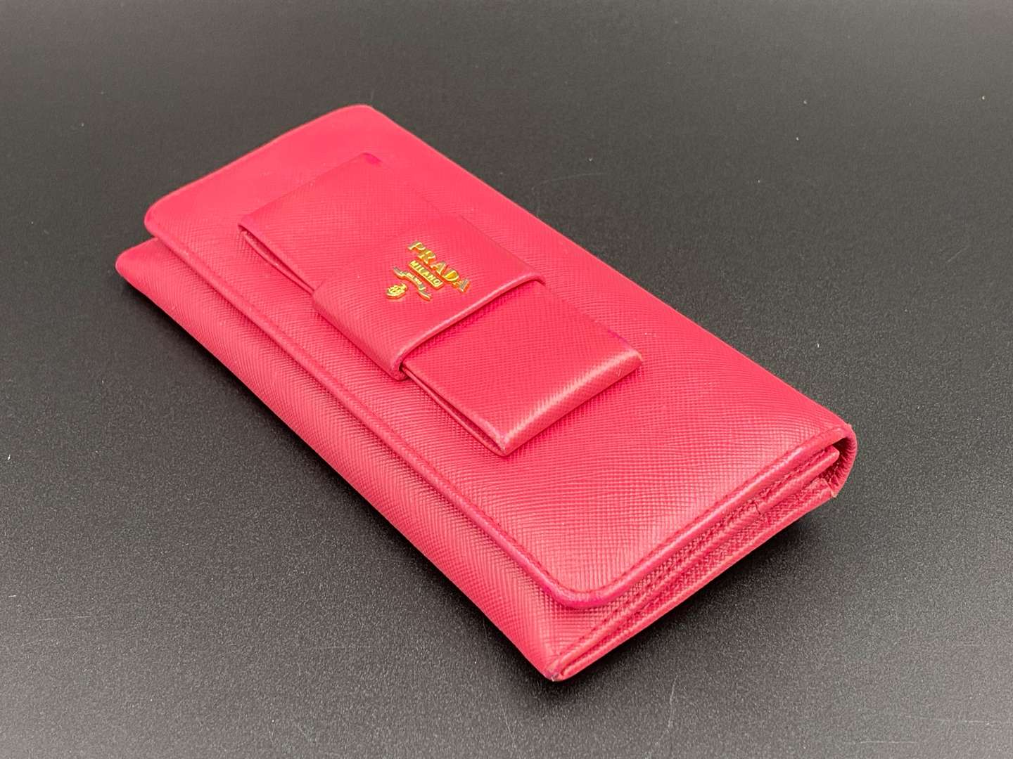 <p>PRADA, a Saffiano, pink leather, ribbon purse,</p>