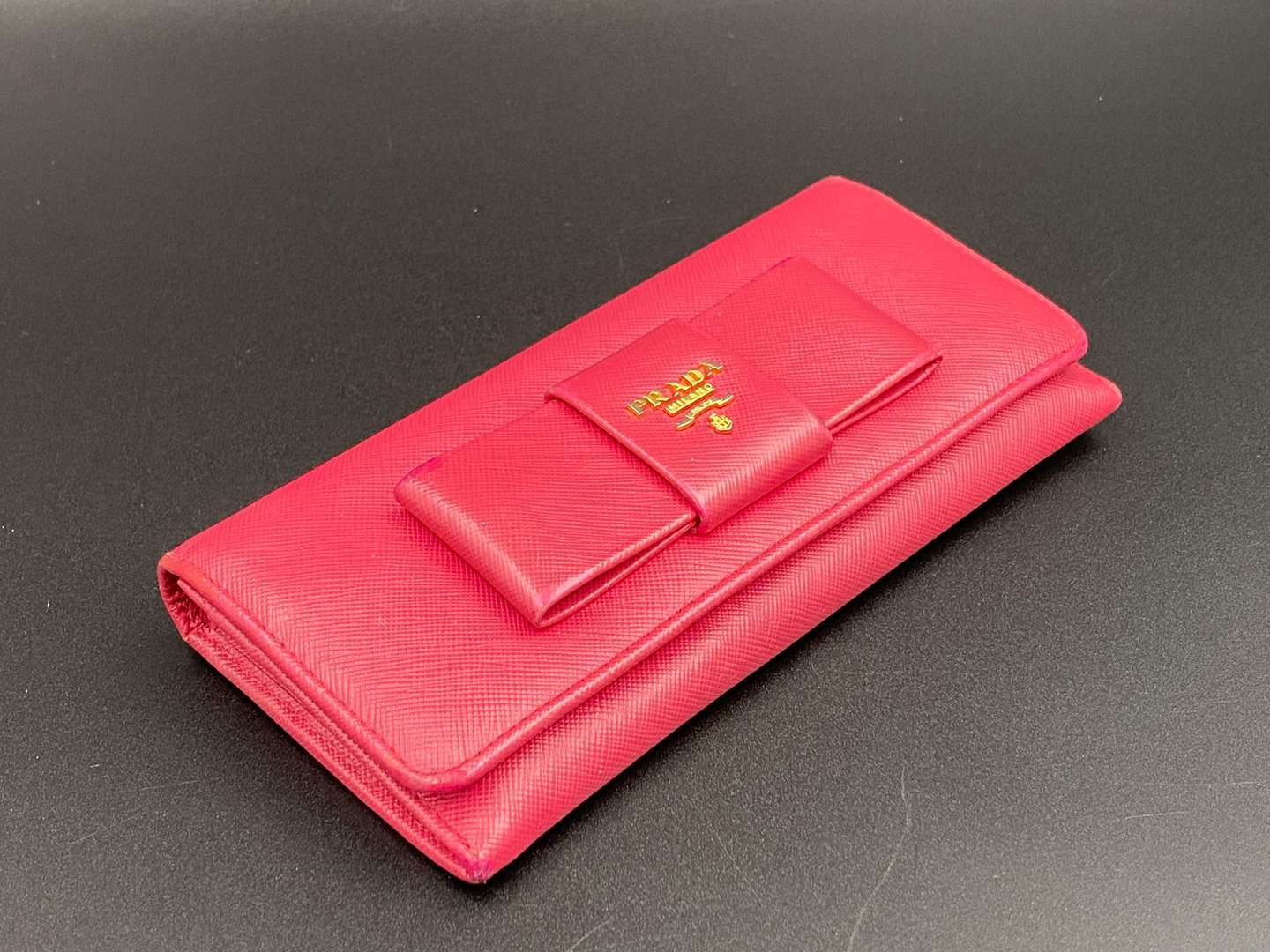 <p>PRADA, a Saffiano, pink leather, ribbon purse,</p>
