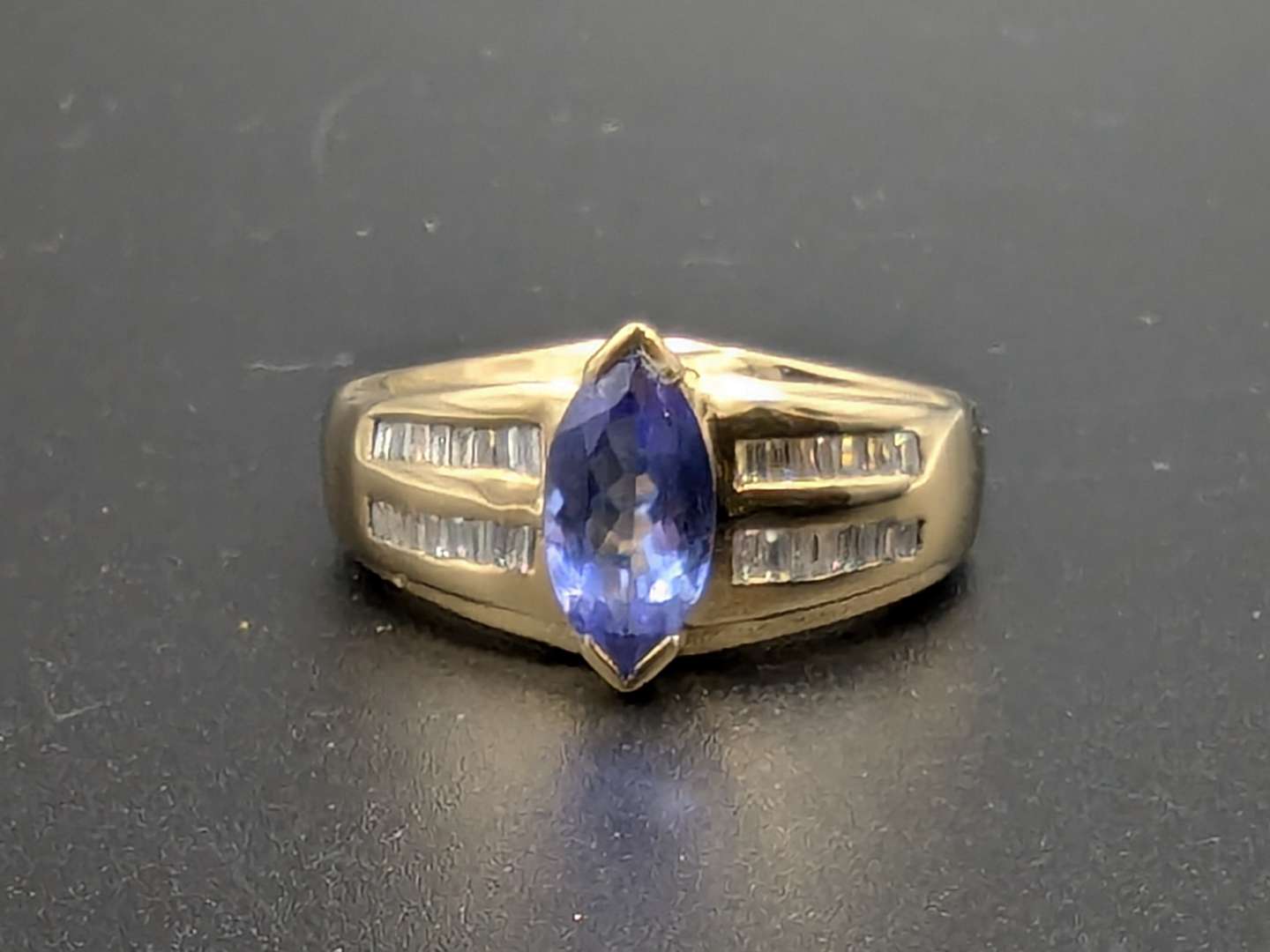 <p>Tanzanite and Diamond 14ct Gold Ring</p>