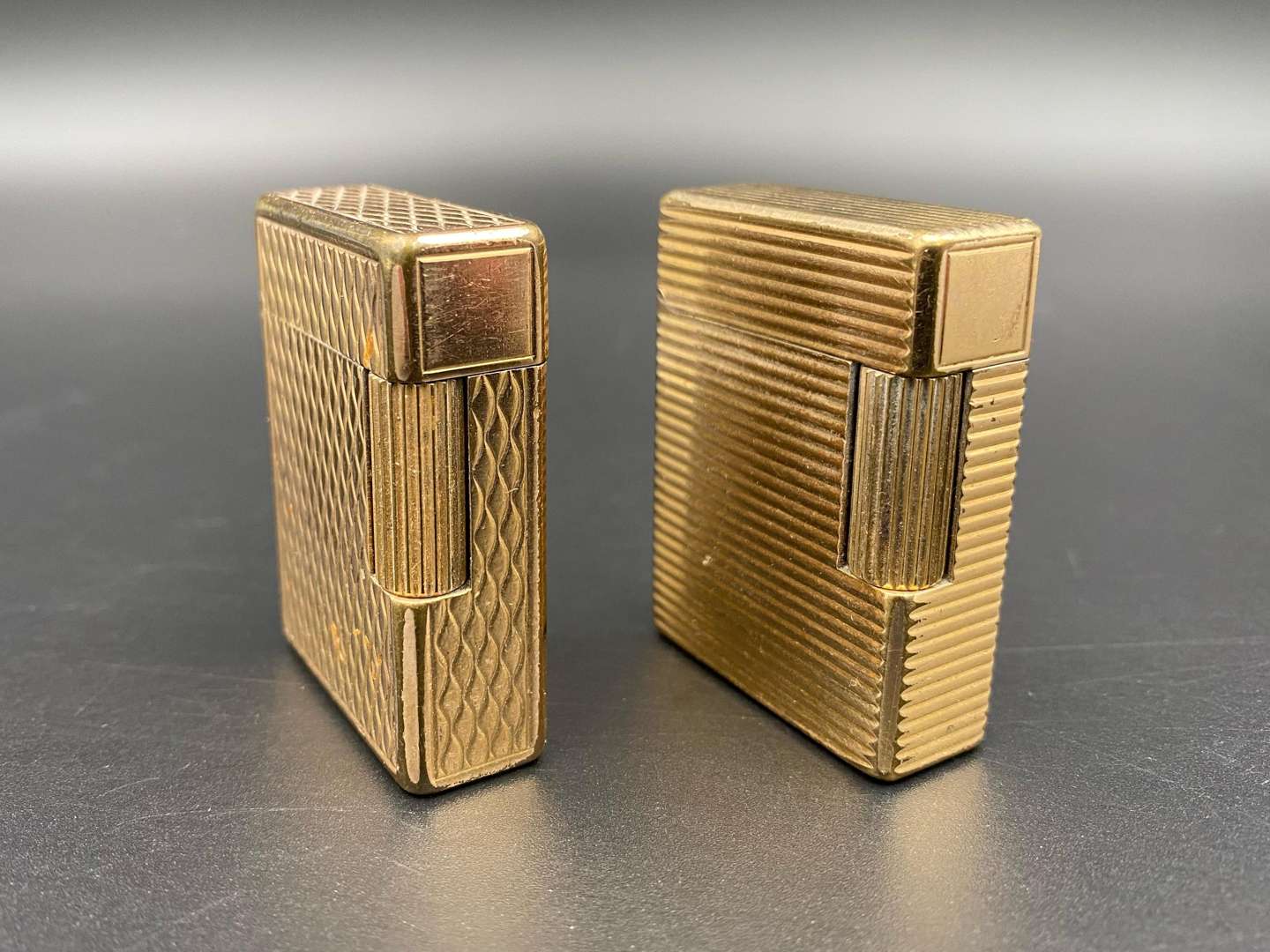 <p>DUPONT, two gold plated gas lighters</p>