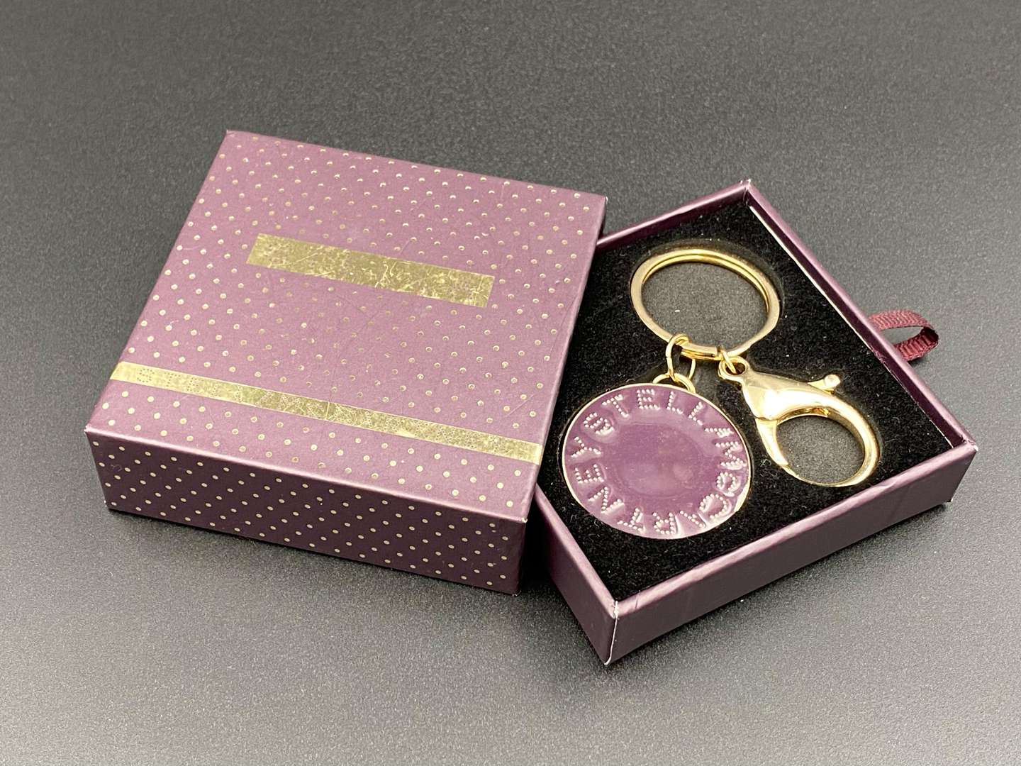 <p>STELLA McCARTNEY, gilt metal key ring and fob,</p>
