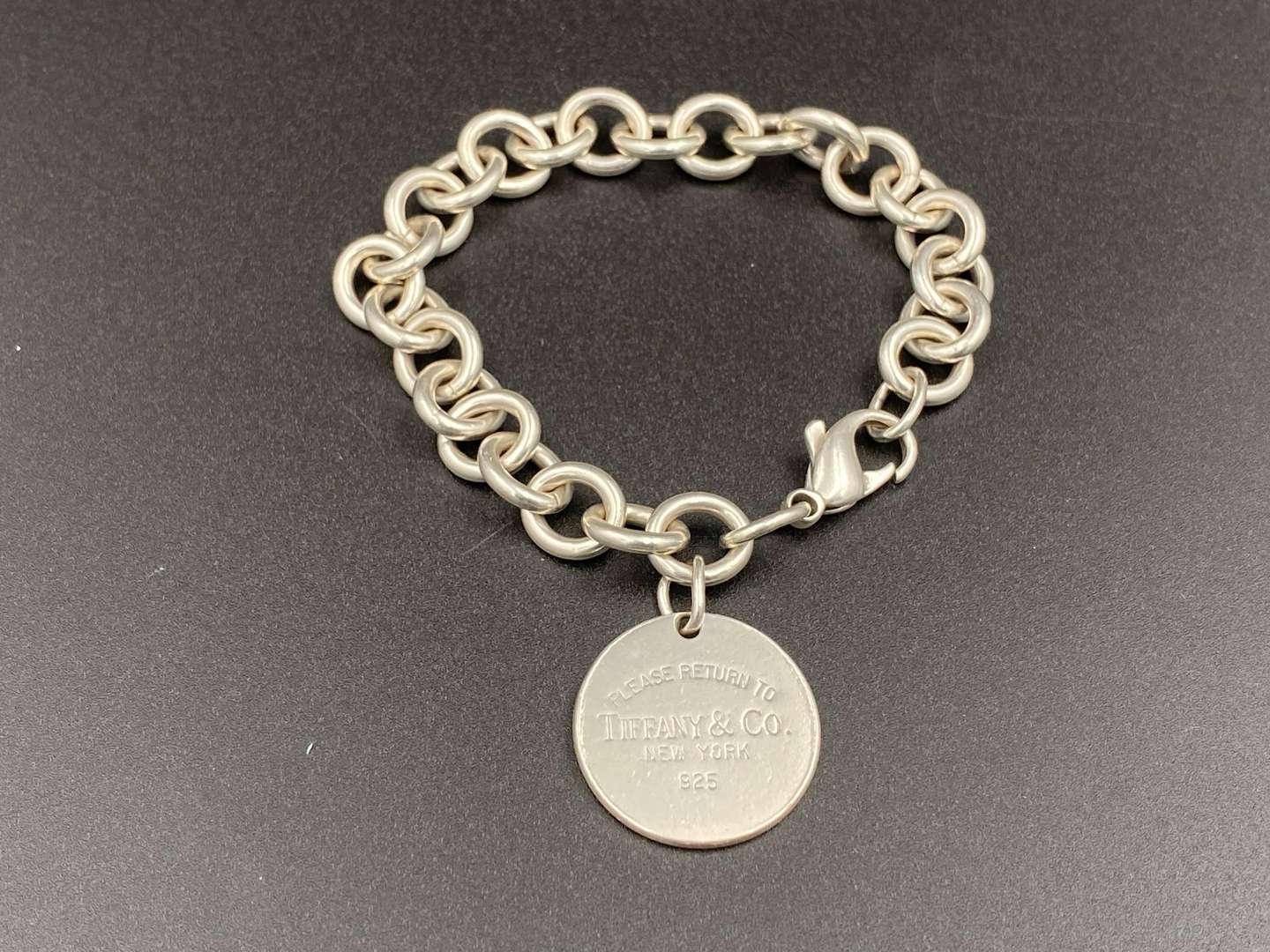 <p>TIFFANY & CO, &nbsp;.925 silver “RETURN TO TIFFANY” charm bracelet,</p>
