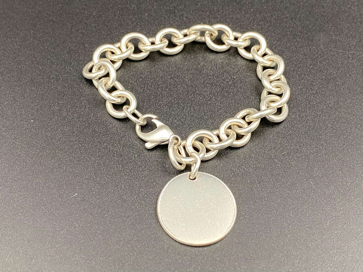<p>TIFFANY & CO, &nbsp;.925 silver “RETURN TO TIFFANY” charm bracelet,</p>