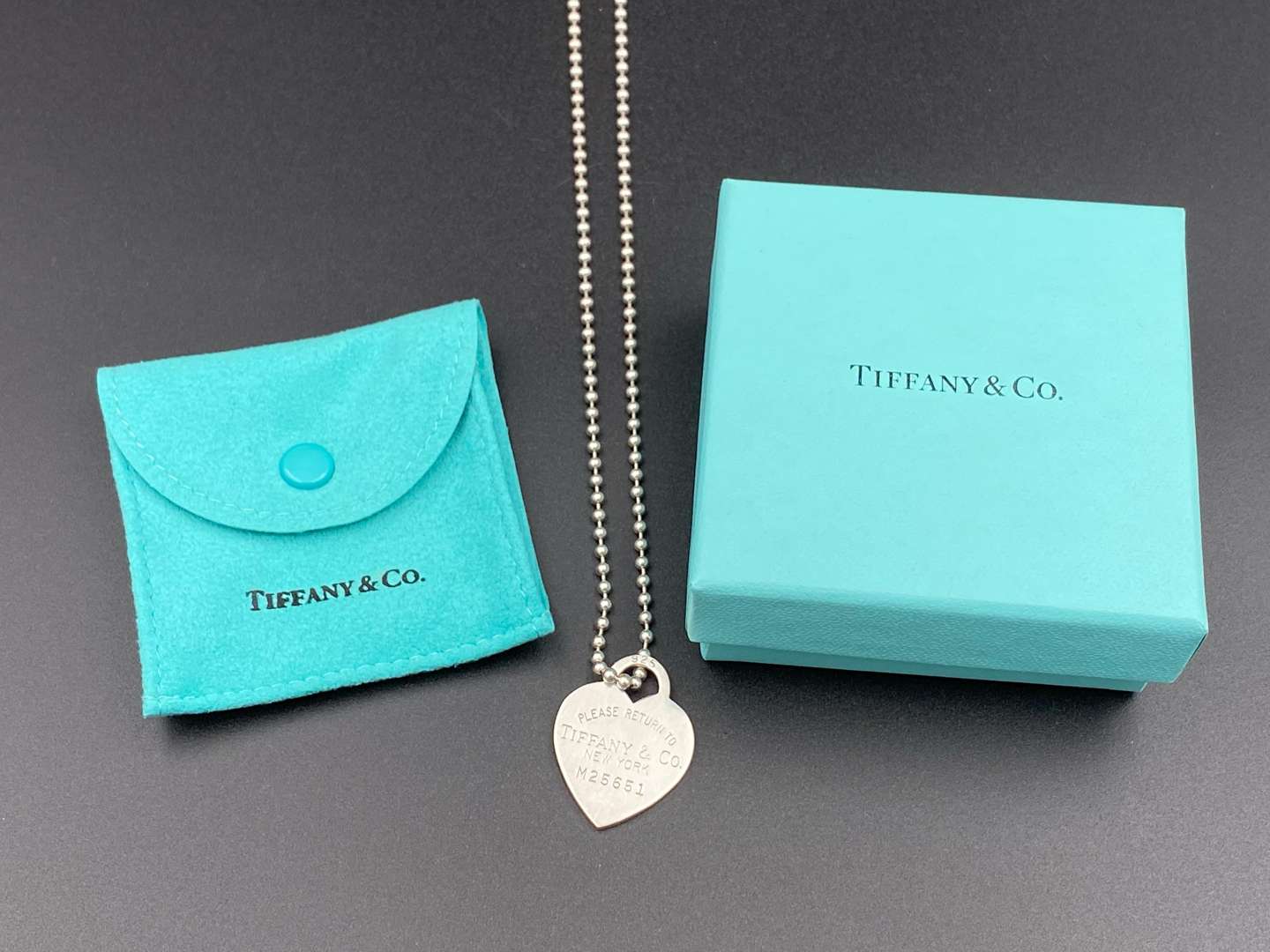 <p>TIFFANY & CO, .925 “RETURN TO TIFFANY”, necklace and charm.</p>