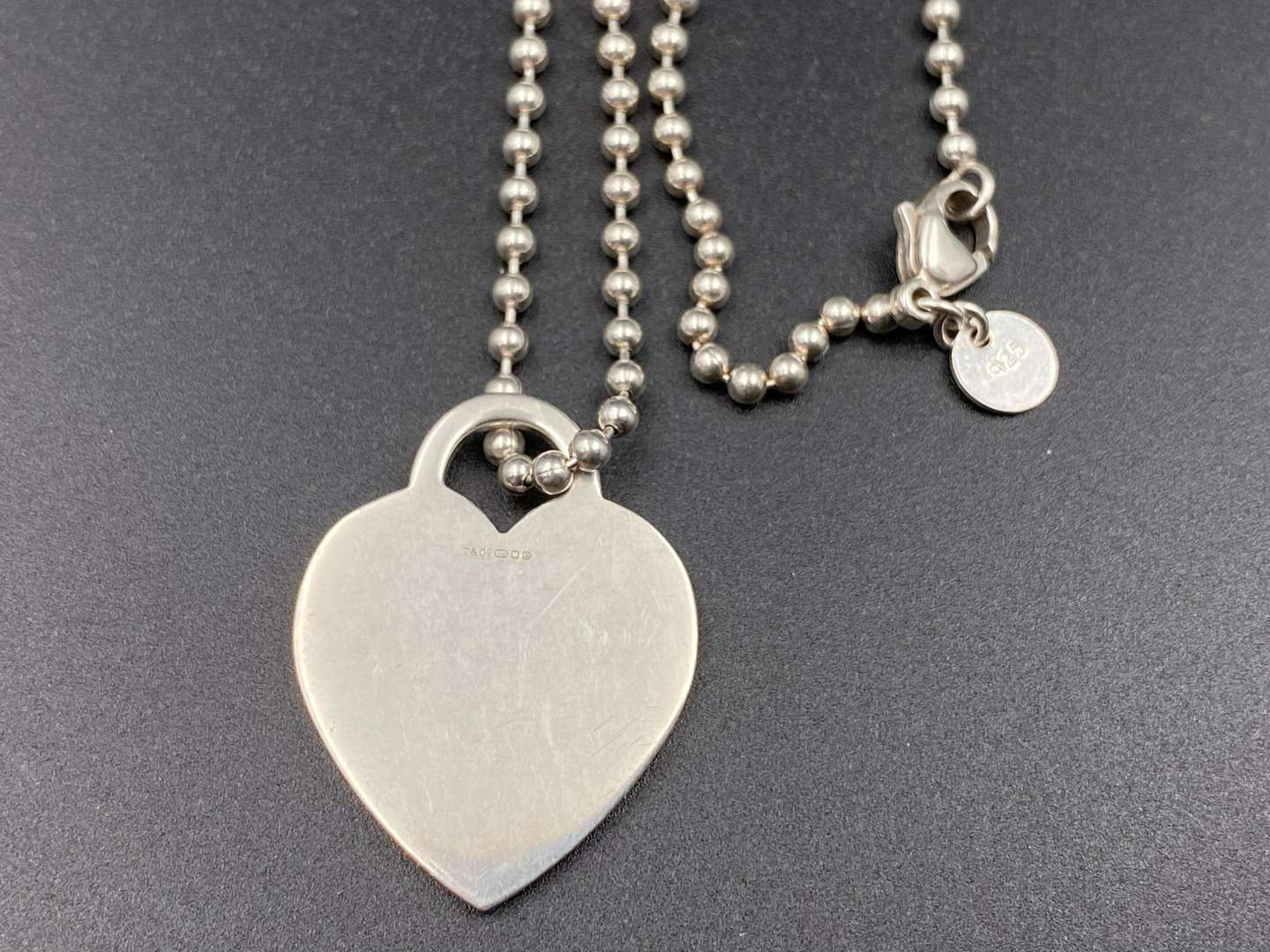 <p>TIFFANY & CO, .925 “RETURN TO TIFFANY”, necklace and charm.</p>