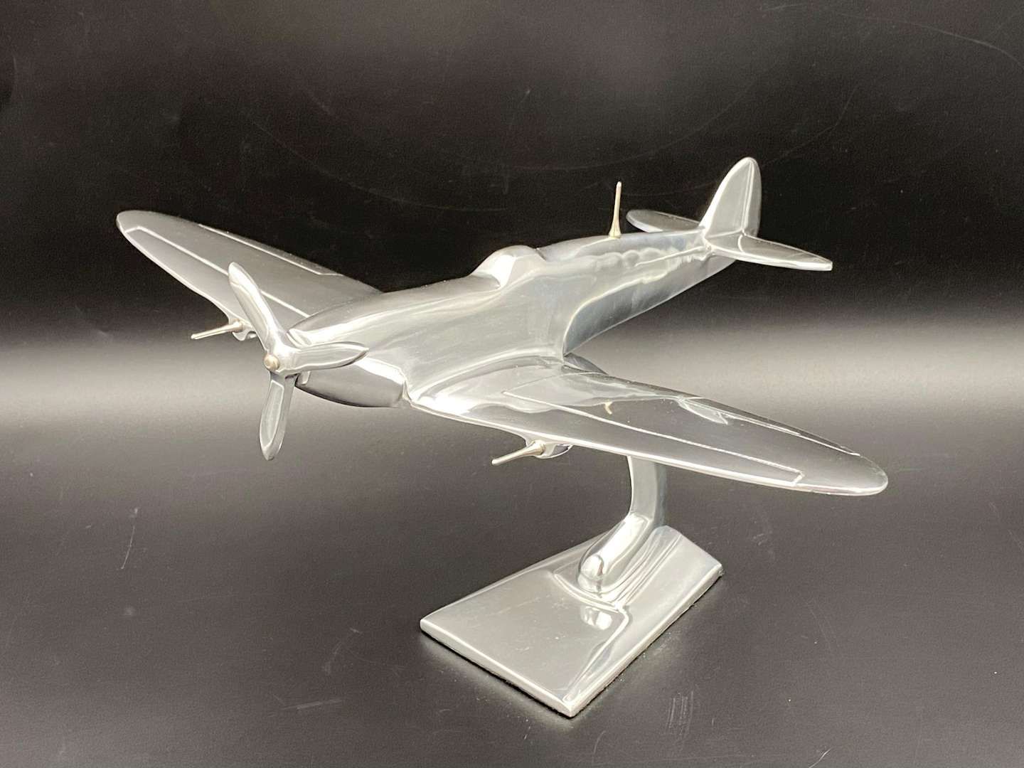 <p>A CAST ALUMINIUM MODEL OF A SPITFIRE FIGHTER PLANE,</p>
