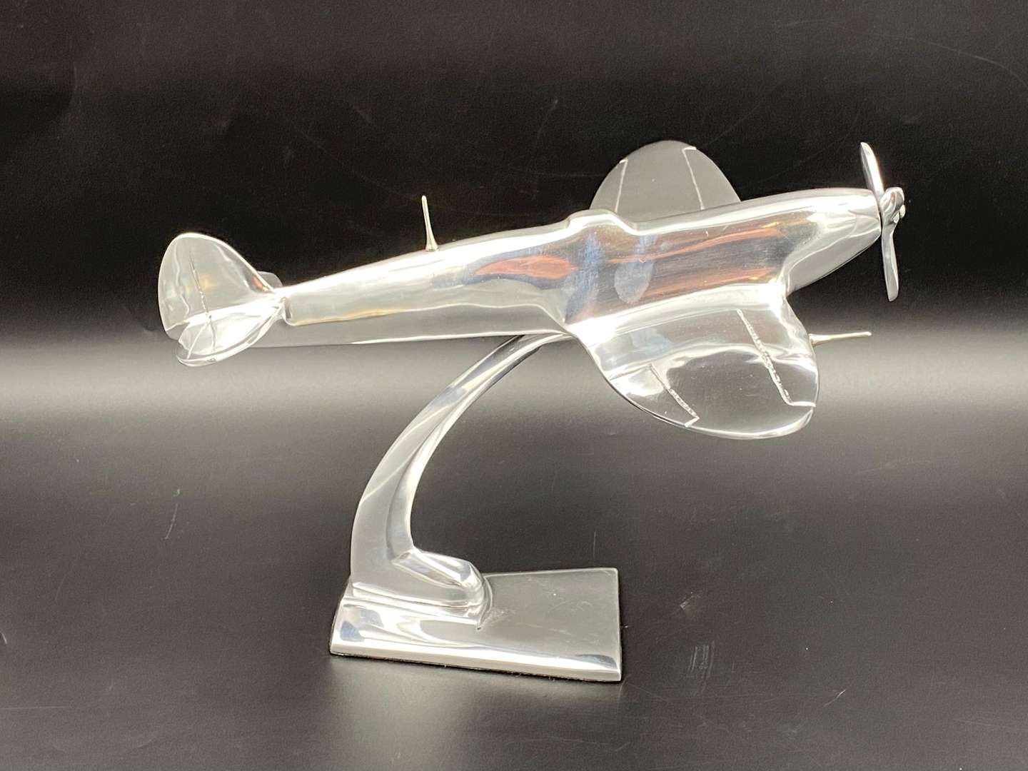 <p>A CAST ALUMINIUM MODEL OF A SPITFIRE FIGHTER PLANE,</p>