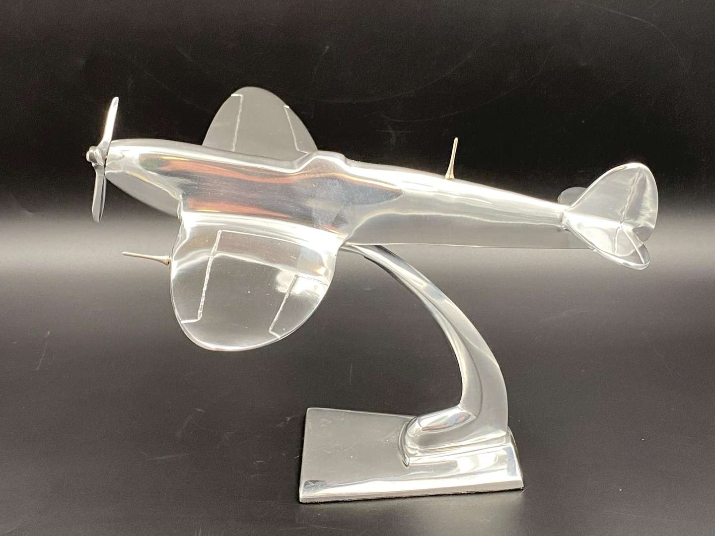 <p>A CAST ALUMINIUM MODEL OF A SPITFIRE FIGHTER PLANE,</p>