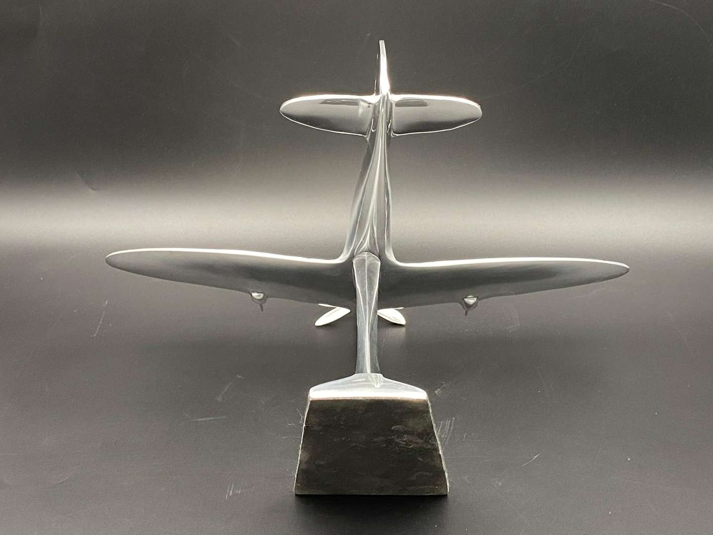 <p>A CAST ALUMINIUM MODEL OF A SPITFIRE FIGHTER PLANE,</p>