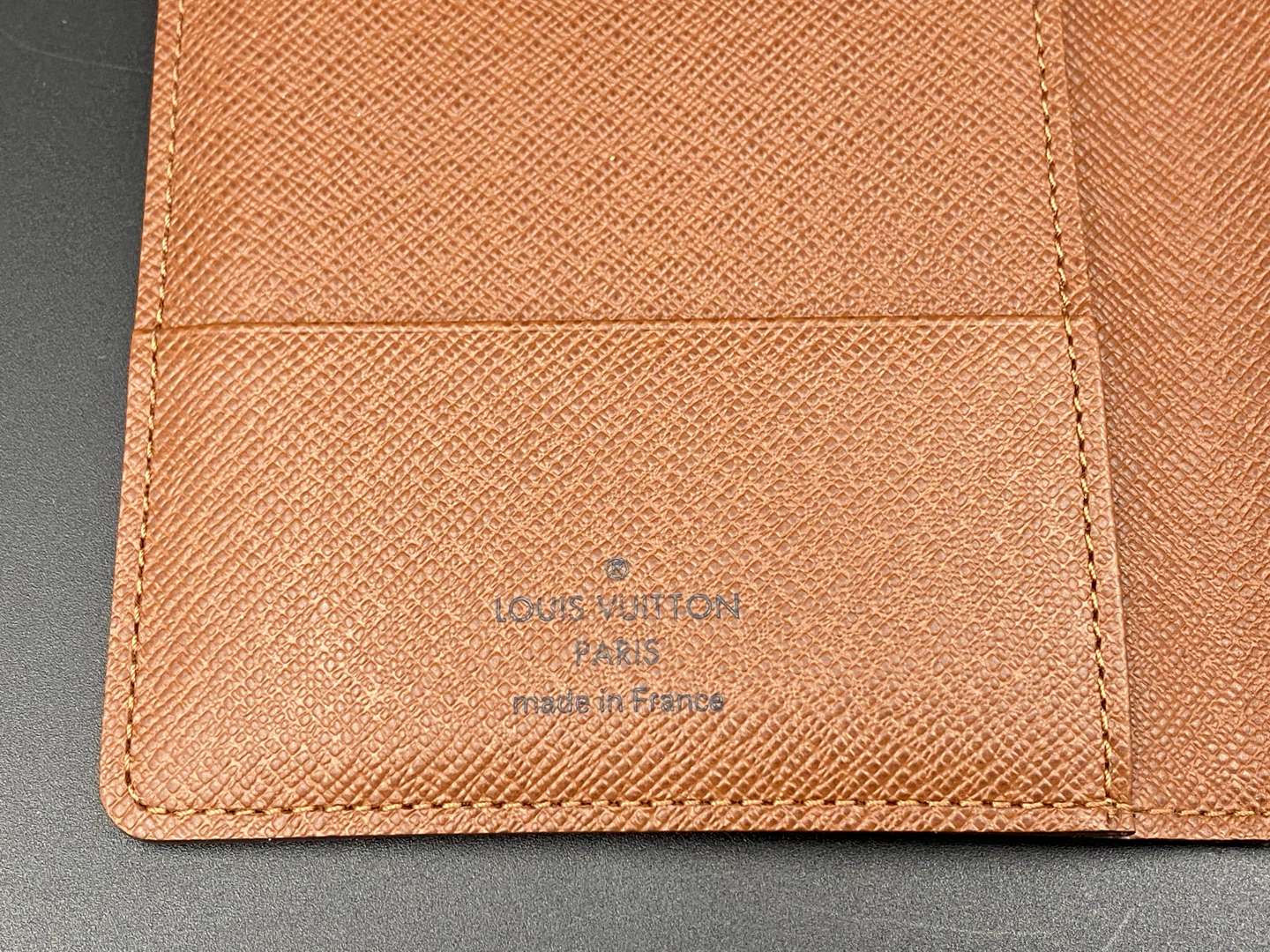 <p>LOUIS VUITTON, a monogrammed, coated canvas and leather passport cover</p>