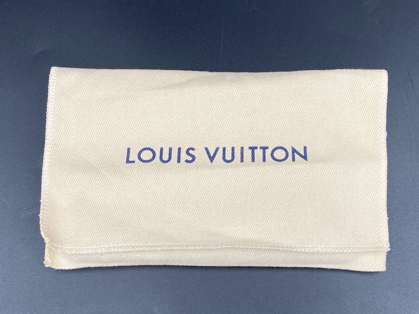 <p>LOUIS VUITTON, a monogrammed, coated canvas and leather passport cover</p>