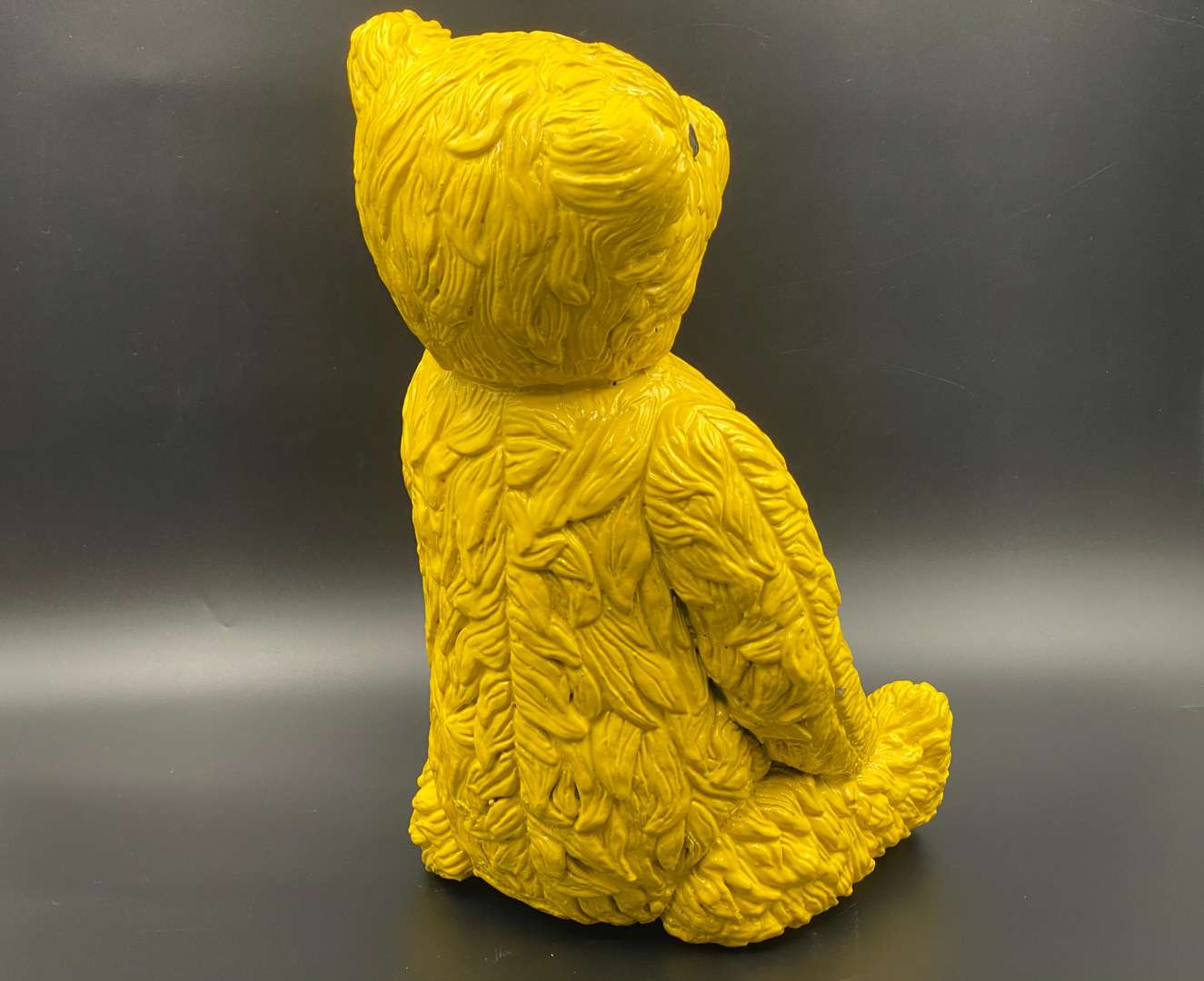 <p>“ALL PROCEEDS TO CHARITY”. A modern cast resin model of a Teddy Bear,</p>