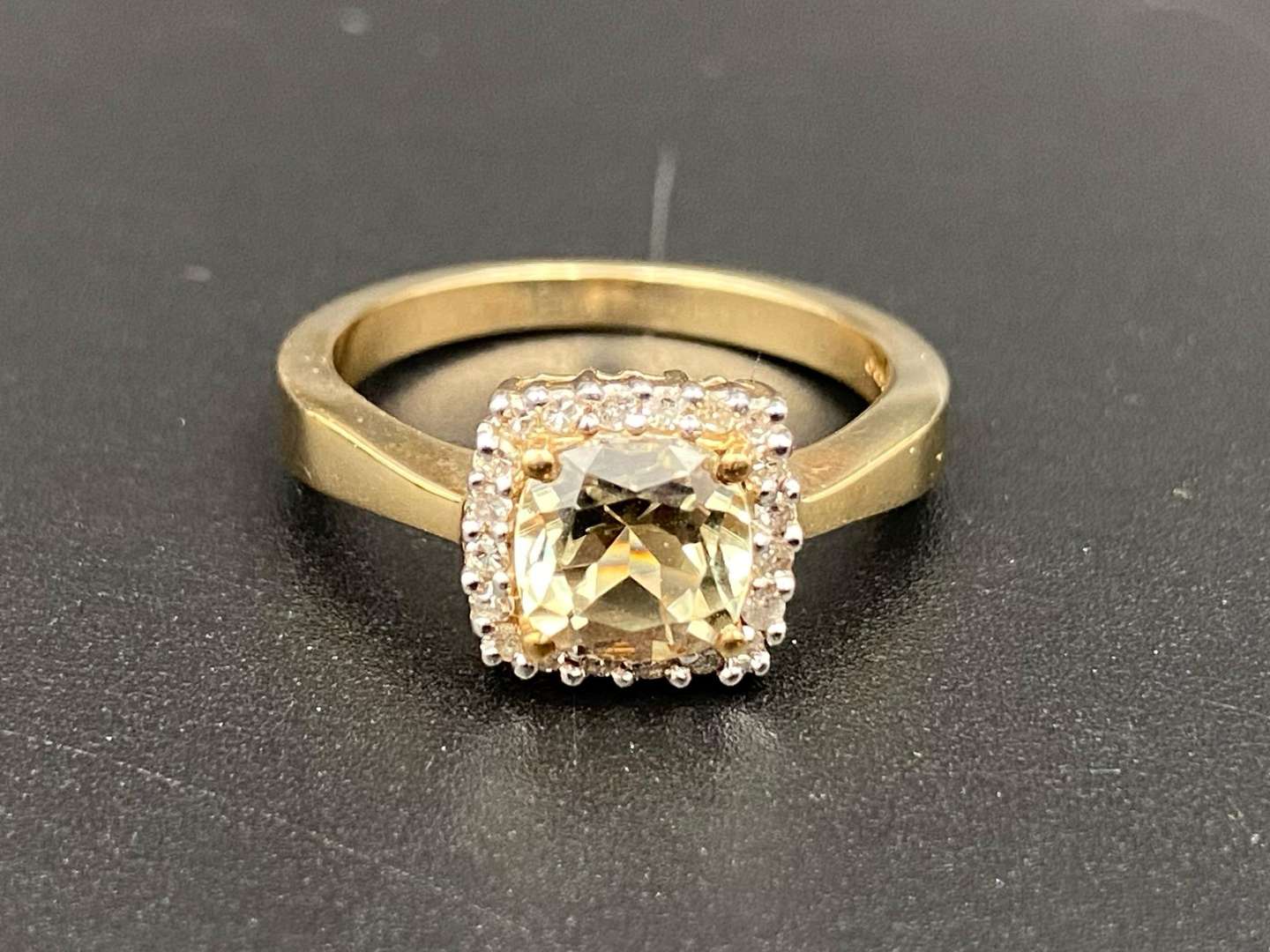 <p>A Citrine and Diamond set, 9ct gold ring.</p>